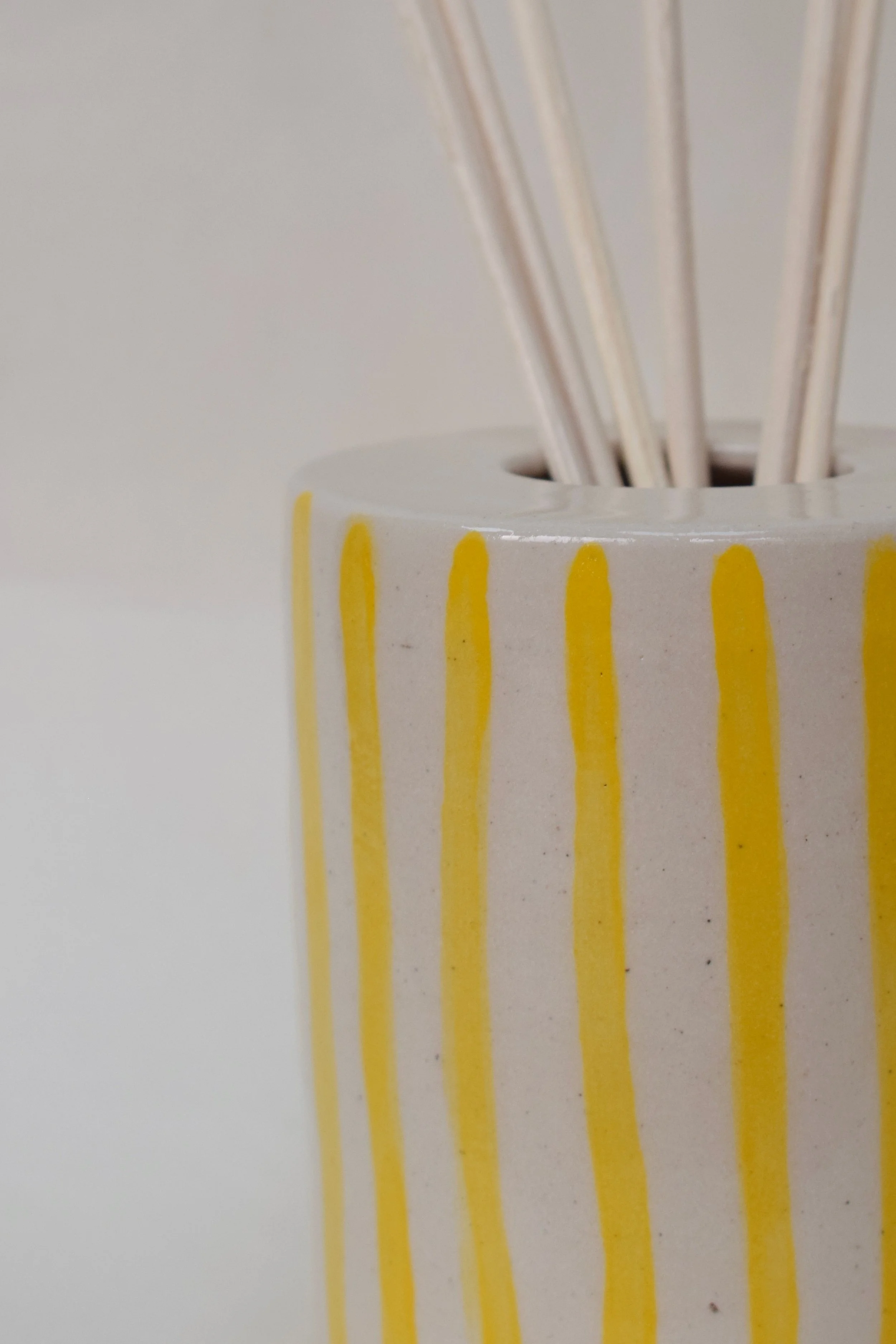 J Lucas Pottery_yellow stripe diffuser pot_closeup.jpeg