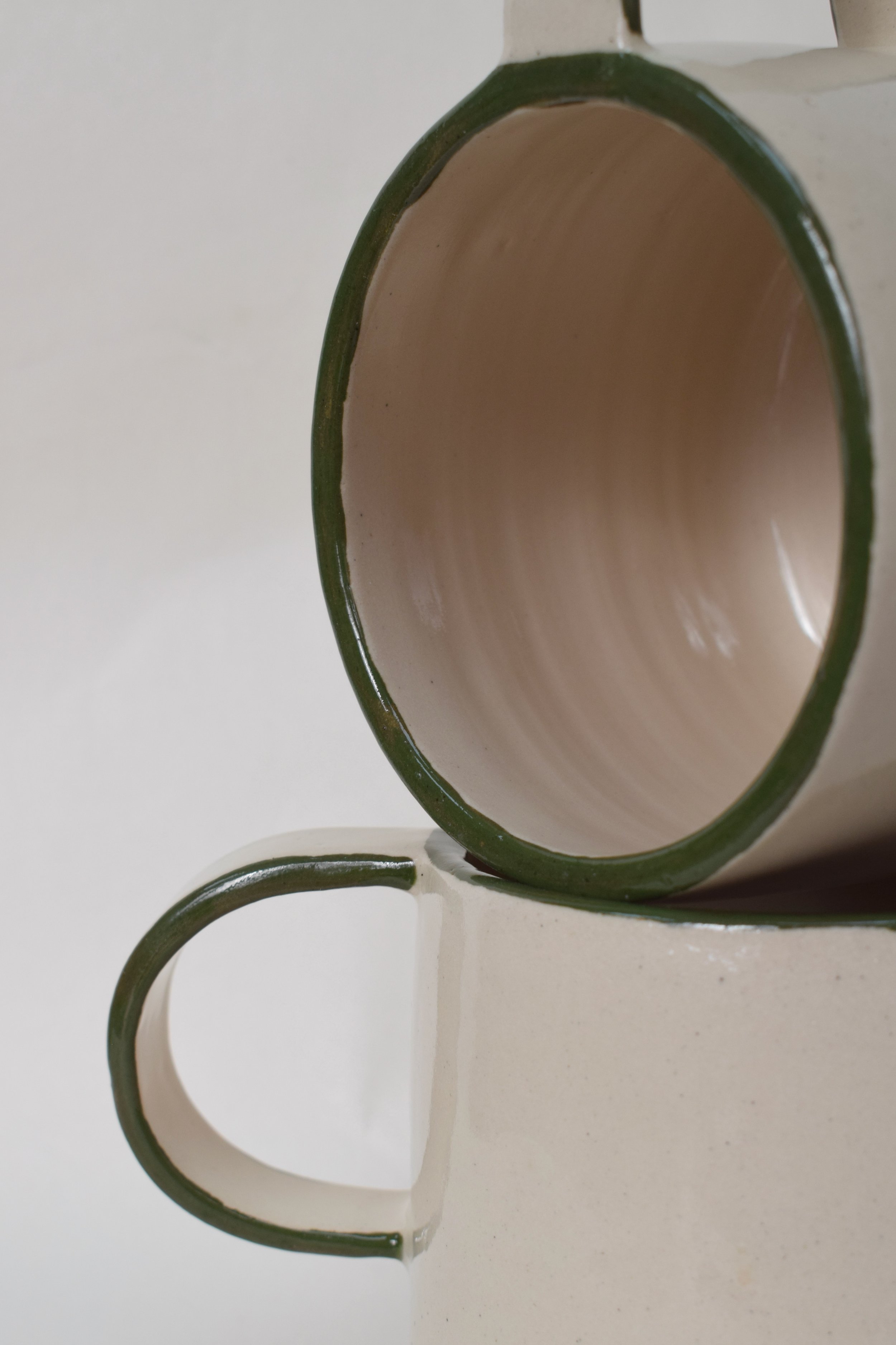 J Lucas Pottery_green edge mugs_close up.jpeg