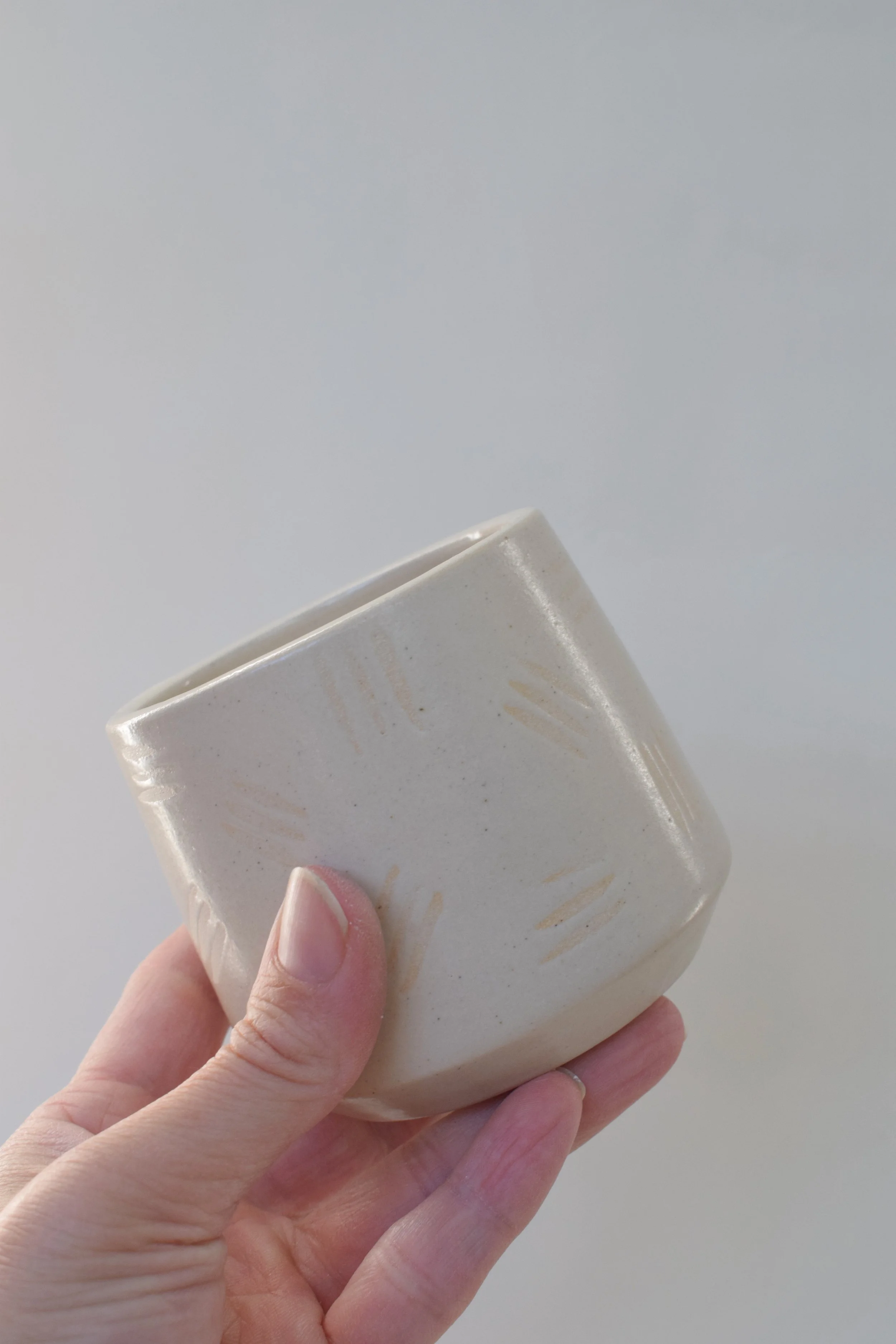 J Lucas Pottery_cotton dash cup_held.jpeg