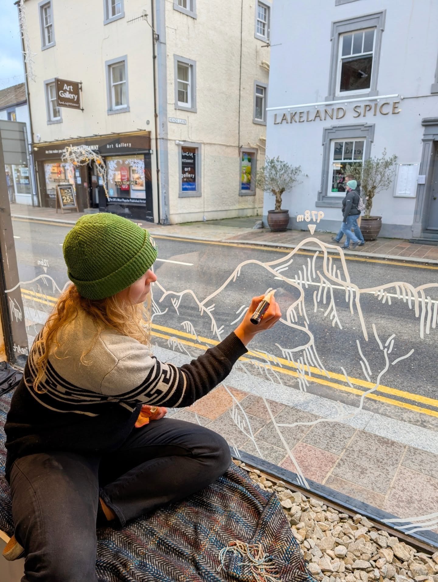 Have you seen my window display at The Real North? 

This was meant to be a Christmas themed mural but we quickly dropped the santas and it's now a more permanent feature! Thanks to Paul for trusting my art for this, we settled on a lake district fel