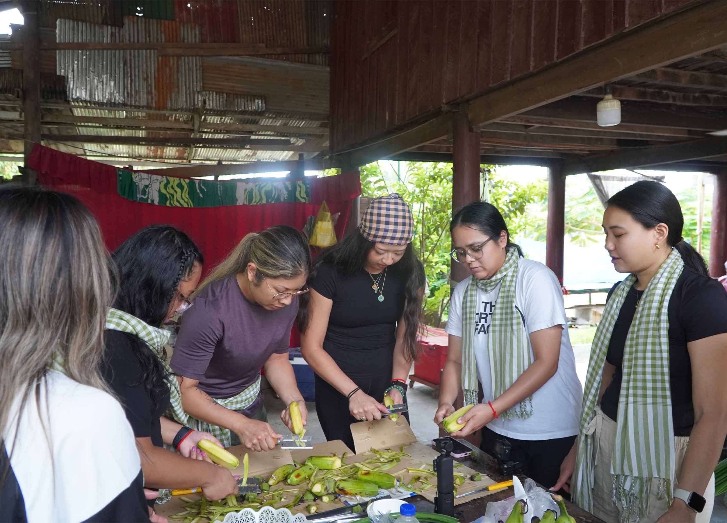 Guest participating with local activity. We were learning about fried banana