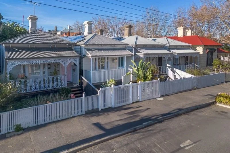 Aerial view of a suburban neighborhood showing multiple houses with solar panels on roofs, labeled landmarks including Clyde Cricket Club, Casey Fields, and Coles, with a house marked in the center.