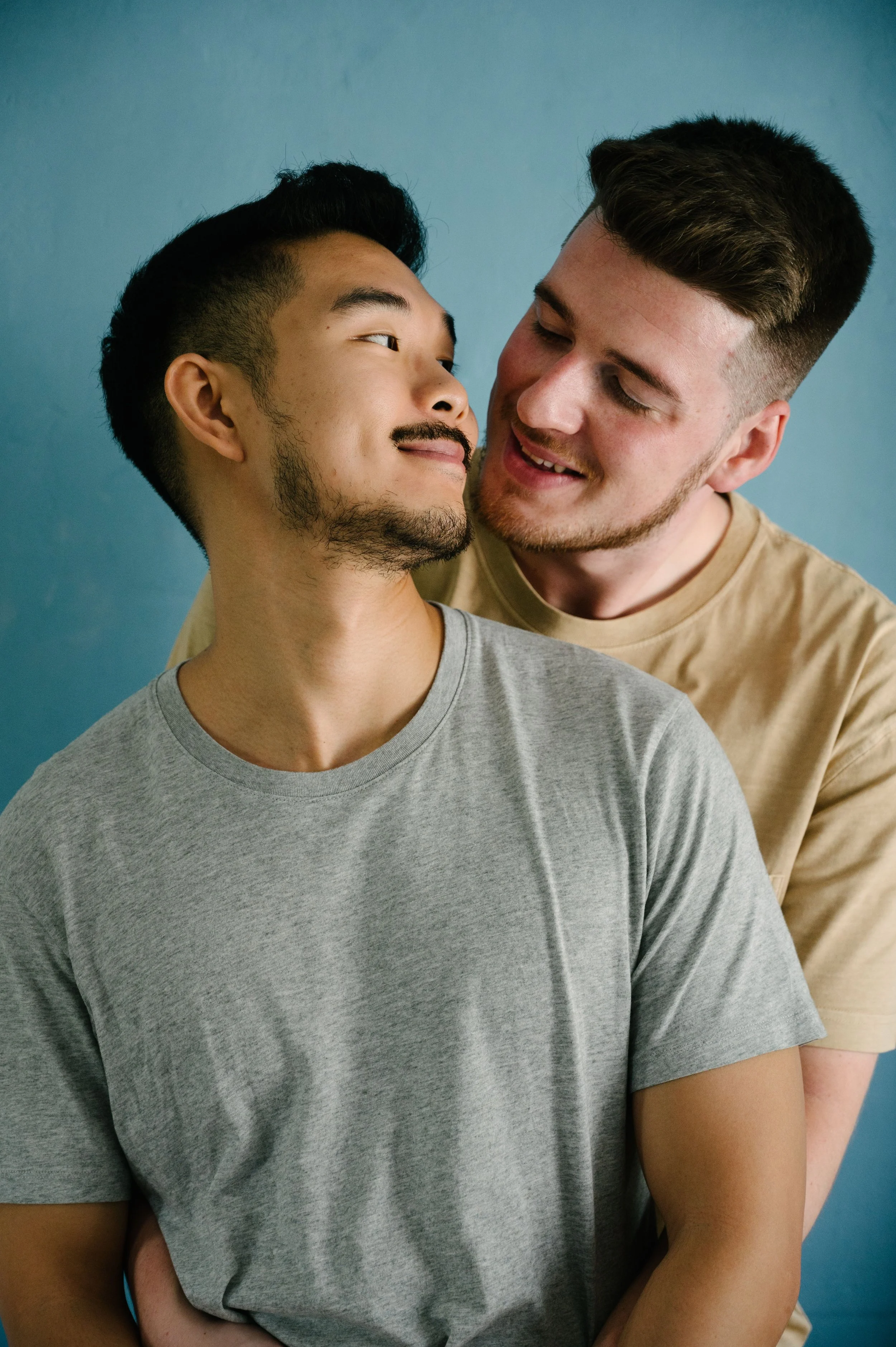 partners holding each other and smiling about gottman method couples therapy
