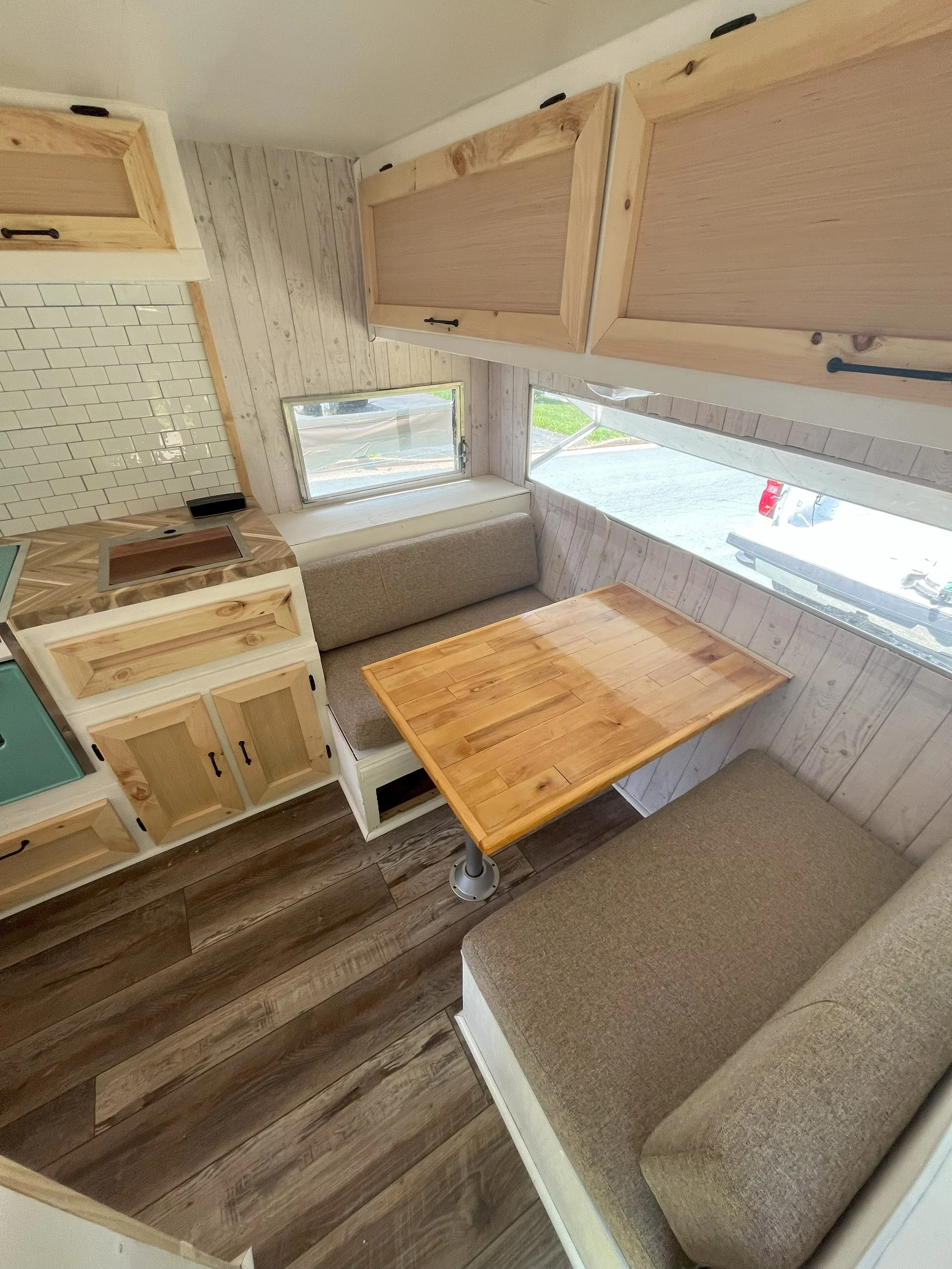 Unpainted Cabinets table from door.jpg