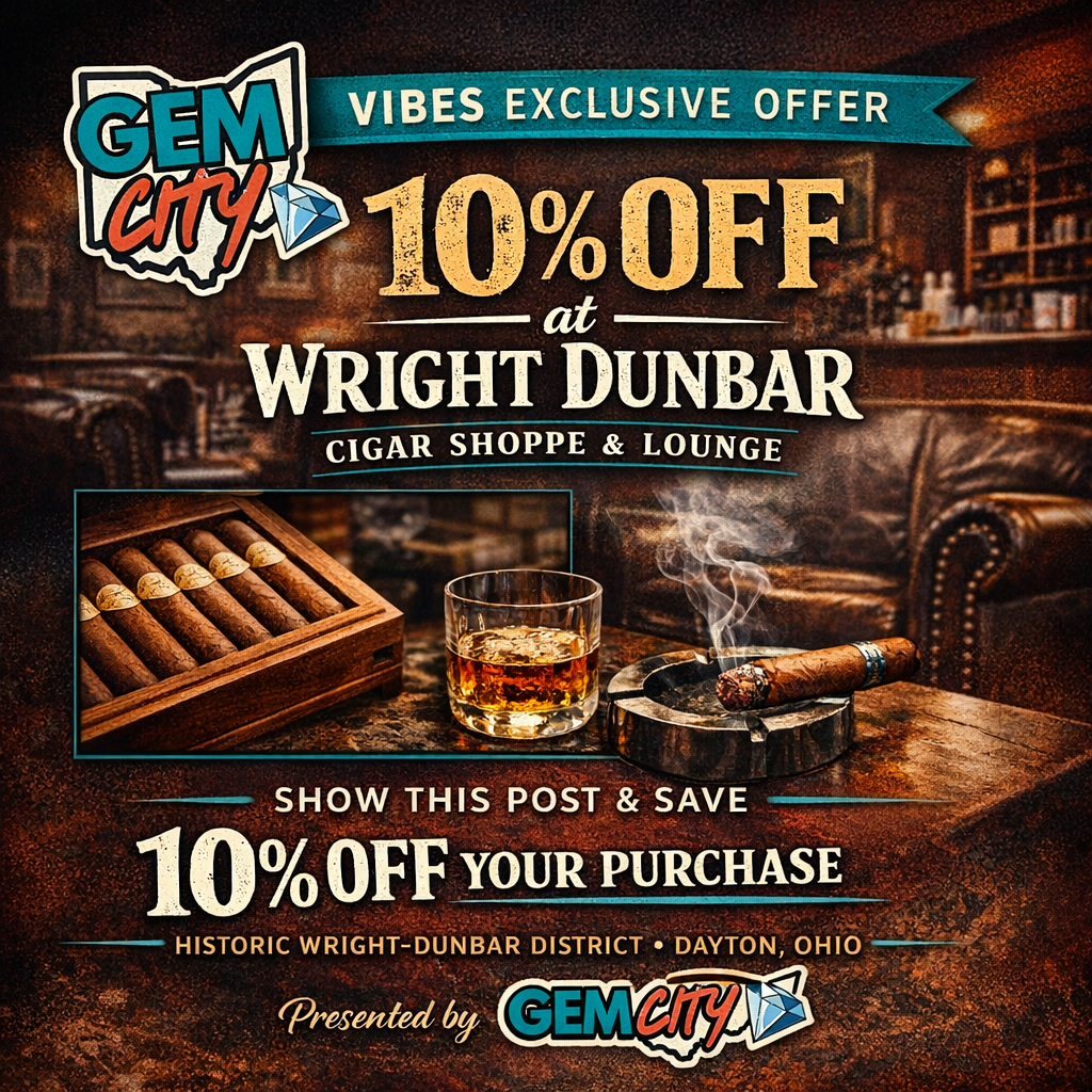 An advertisement offering 10% off at Wright Dunbar Cigar Shop & Lounge in Dayton, Ohio, with a special promotion from Gem City. Features a cigar, a glass of whiskey, and a wooden cigar box in a cozy bar setting.