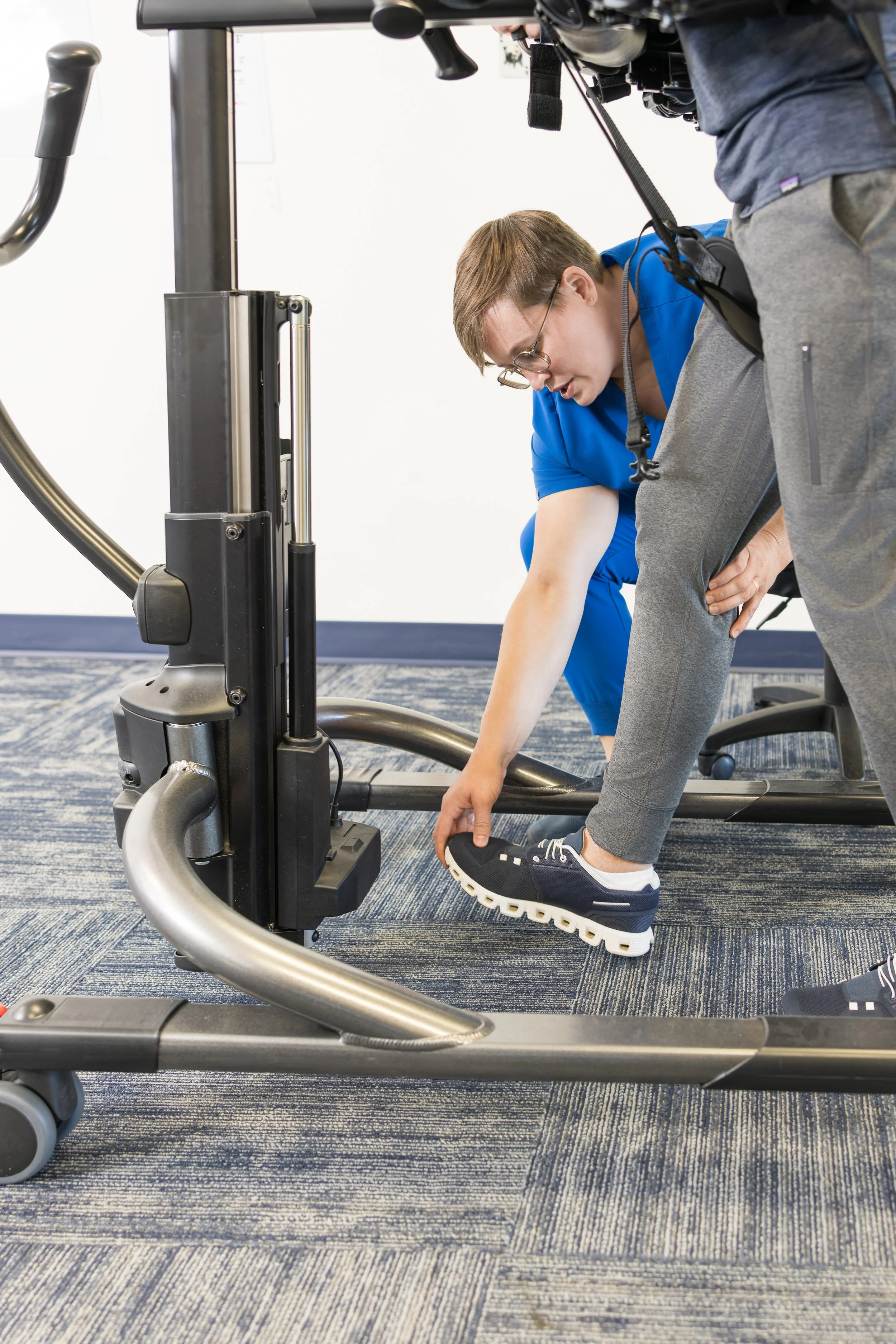 Physical therapist performing high intensity gait training for patient after motor vehicle (car) accident.