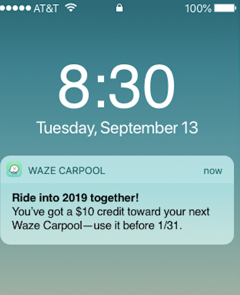 Smartphone lock screen showing the time as 8:30, date as Tuesday, September 13, and a Waze Carpool notification offering a $10 credit for rides booked before January 31.