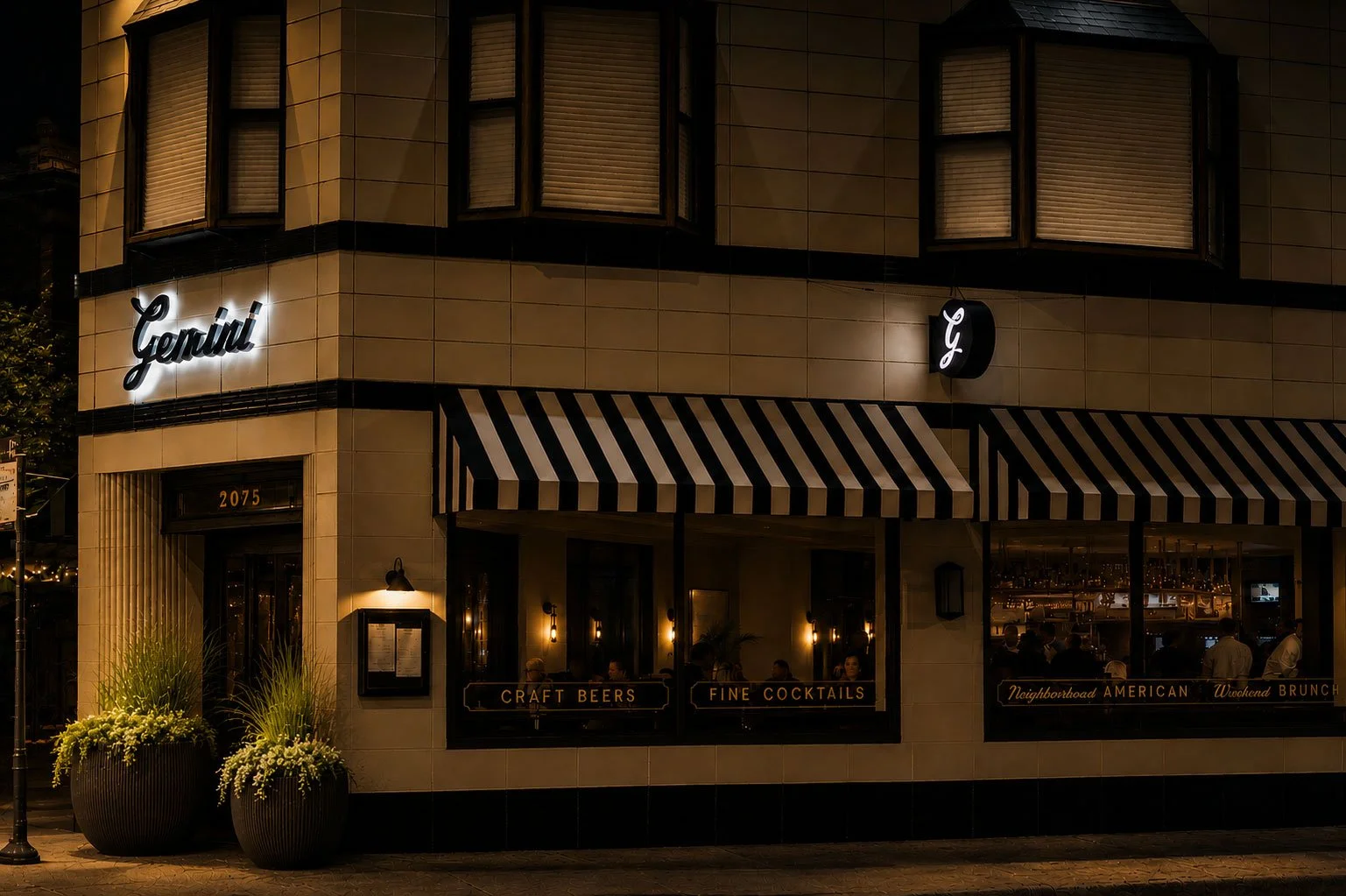 Exterior of a restaurant called Gemini with black and white striped awnings, black framing around windows and door, and the street number 2075 above the entrance.