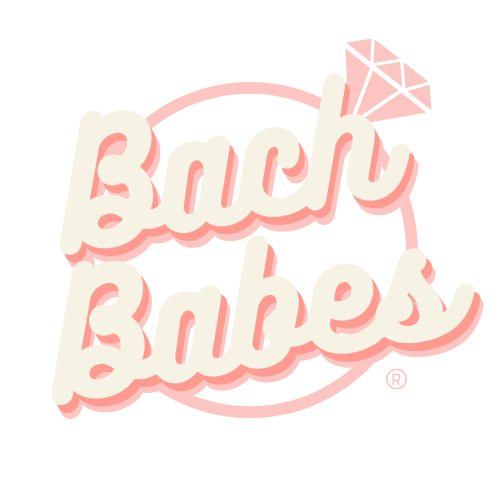 Logo for Bach Babes with pink and white text, pink oval outline, and a diamond illustration at the top right.