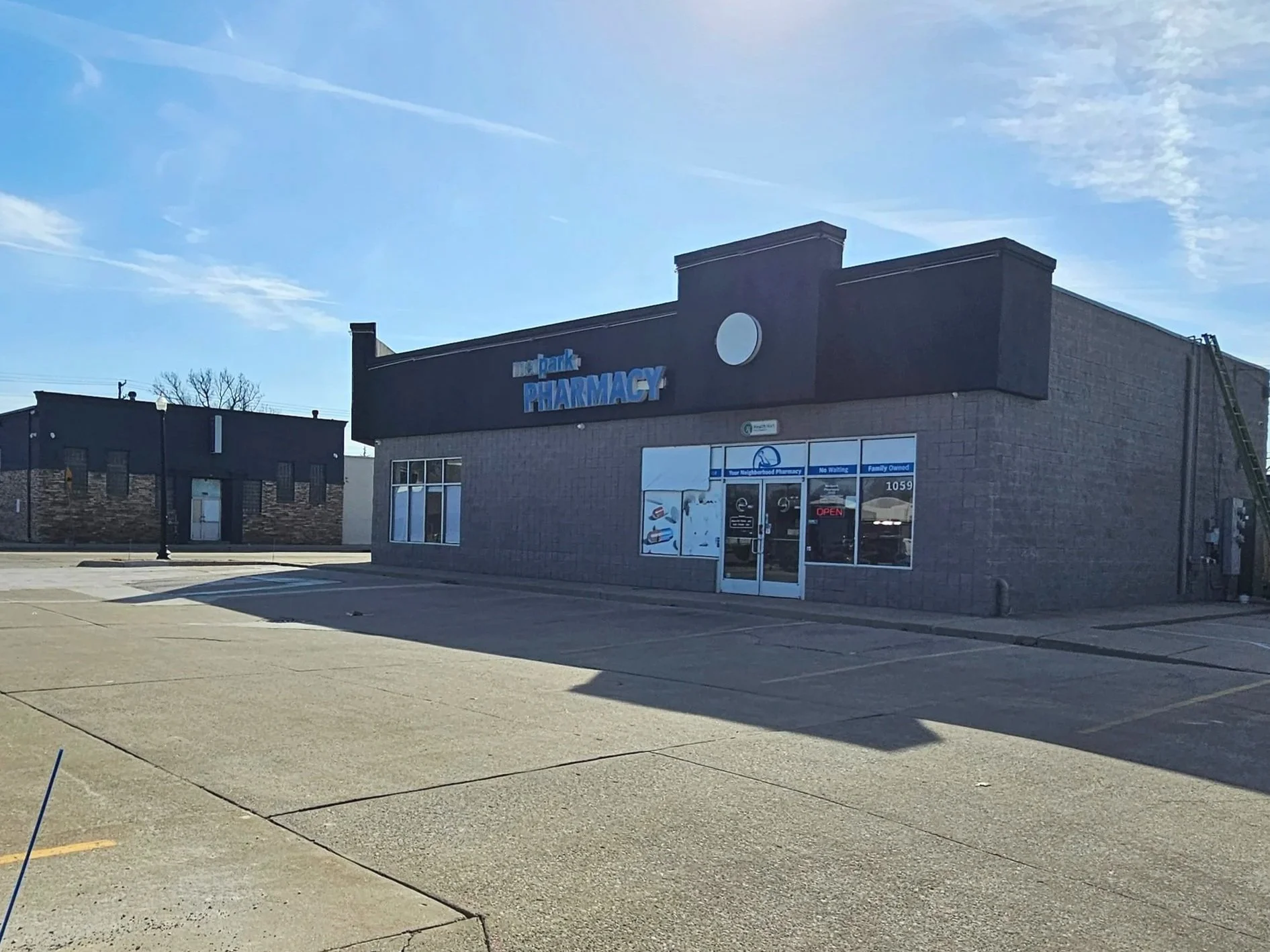 Commercial Exterior Repaint: Medpark Pharmacy in Oak Park, Michigan