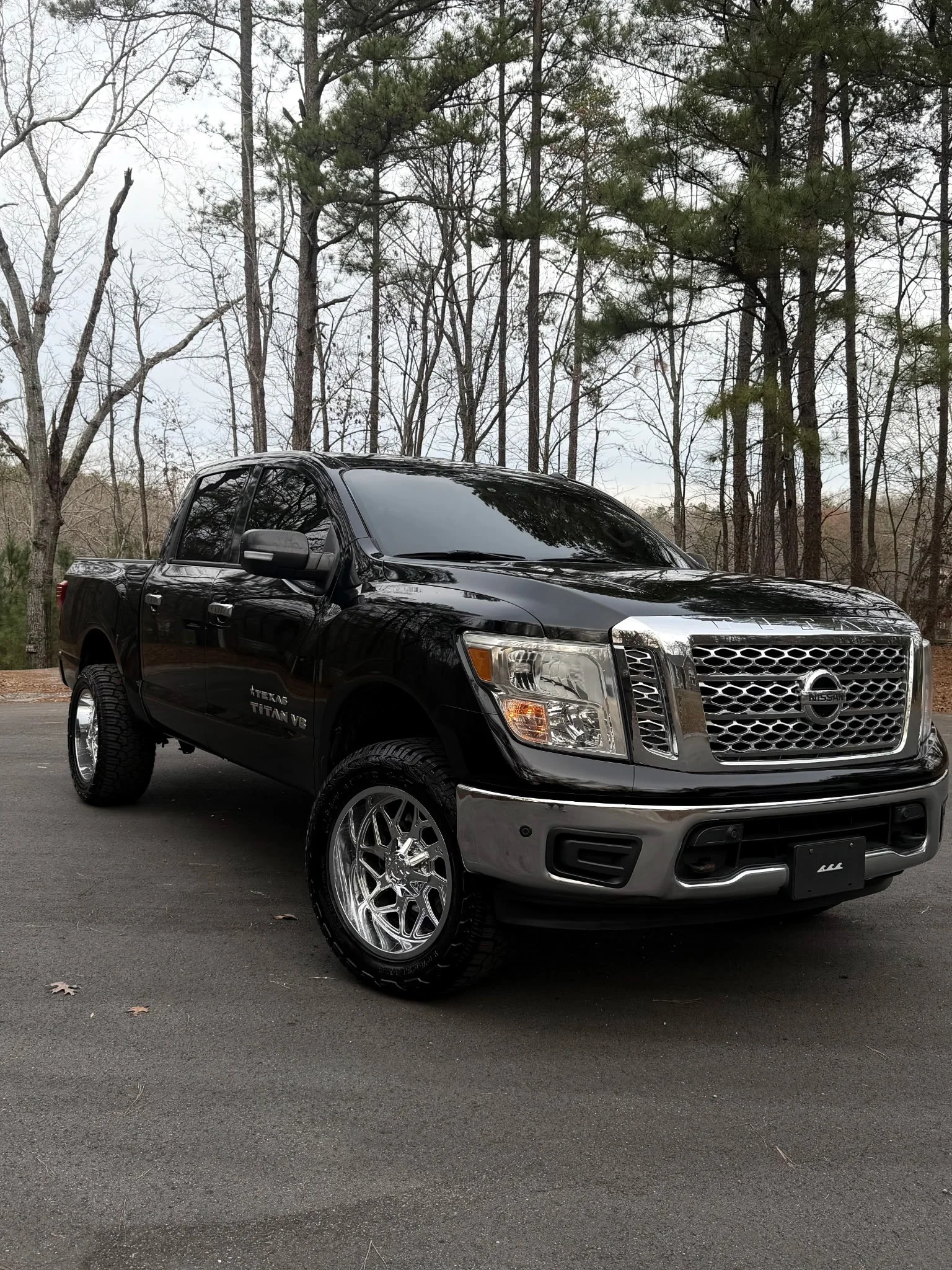 Black Nissan Titan pickup truck with professionally tinted windows by Only Shades Mobile Window Tinting