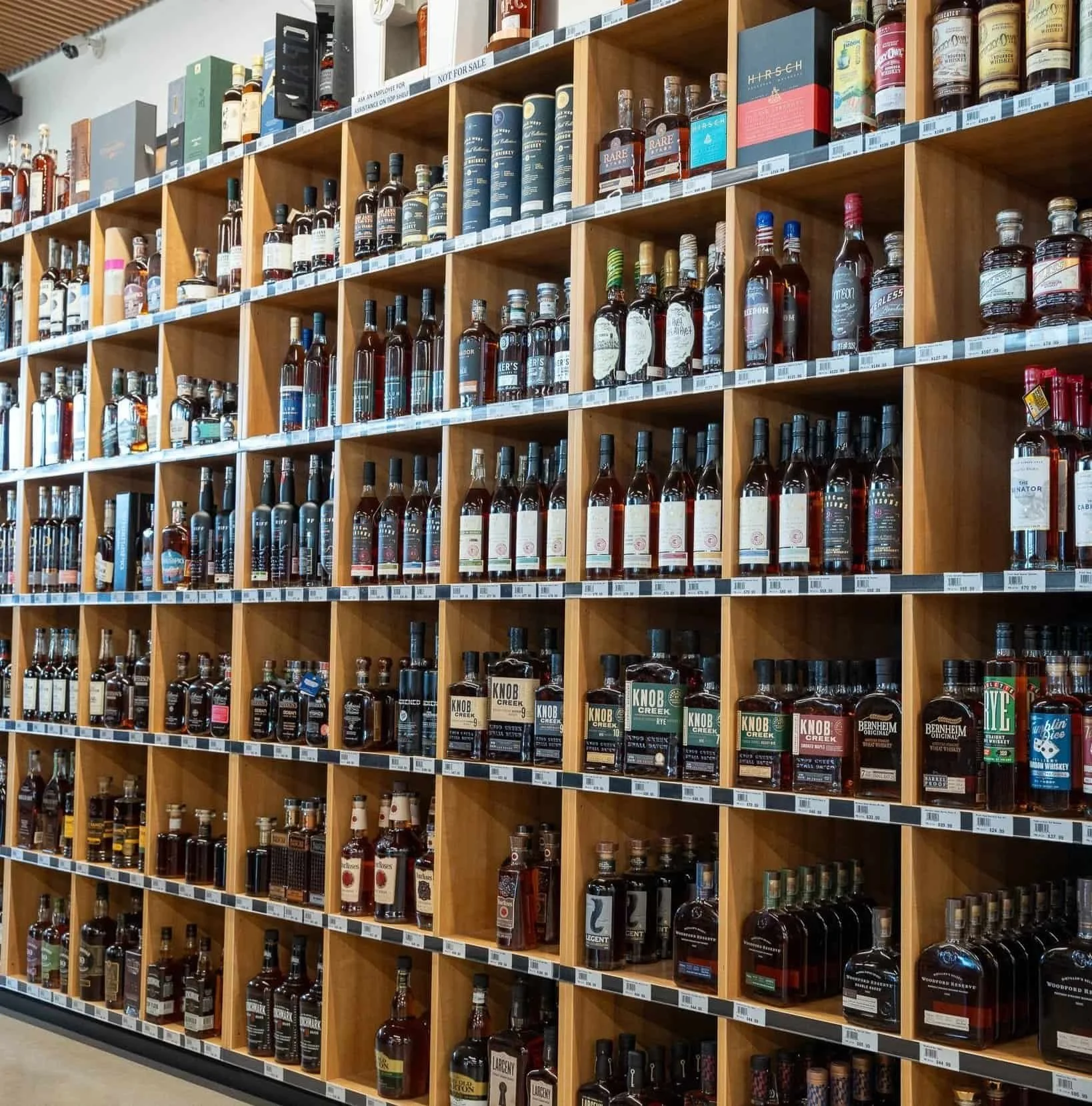 Shelves filled with various types of alcohol.