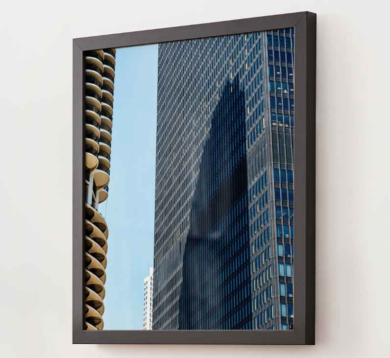 Reflection of tall modern skyscrapers in a glass window