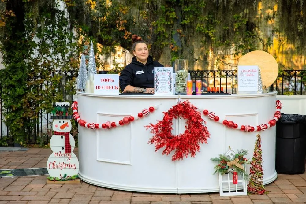 Half Moon Bar shown with Christmas decor and bartender