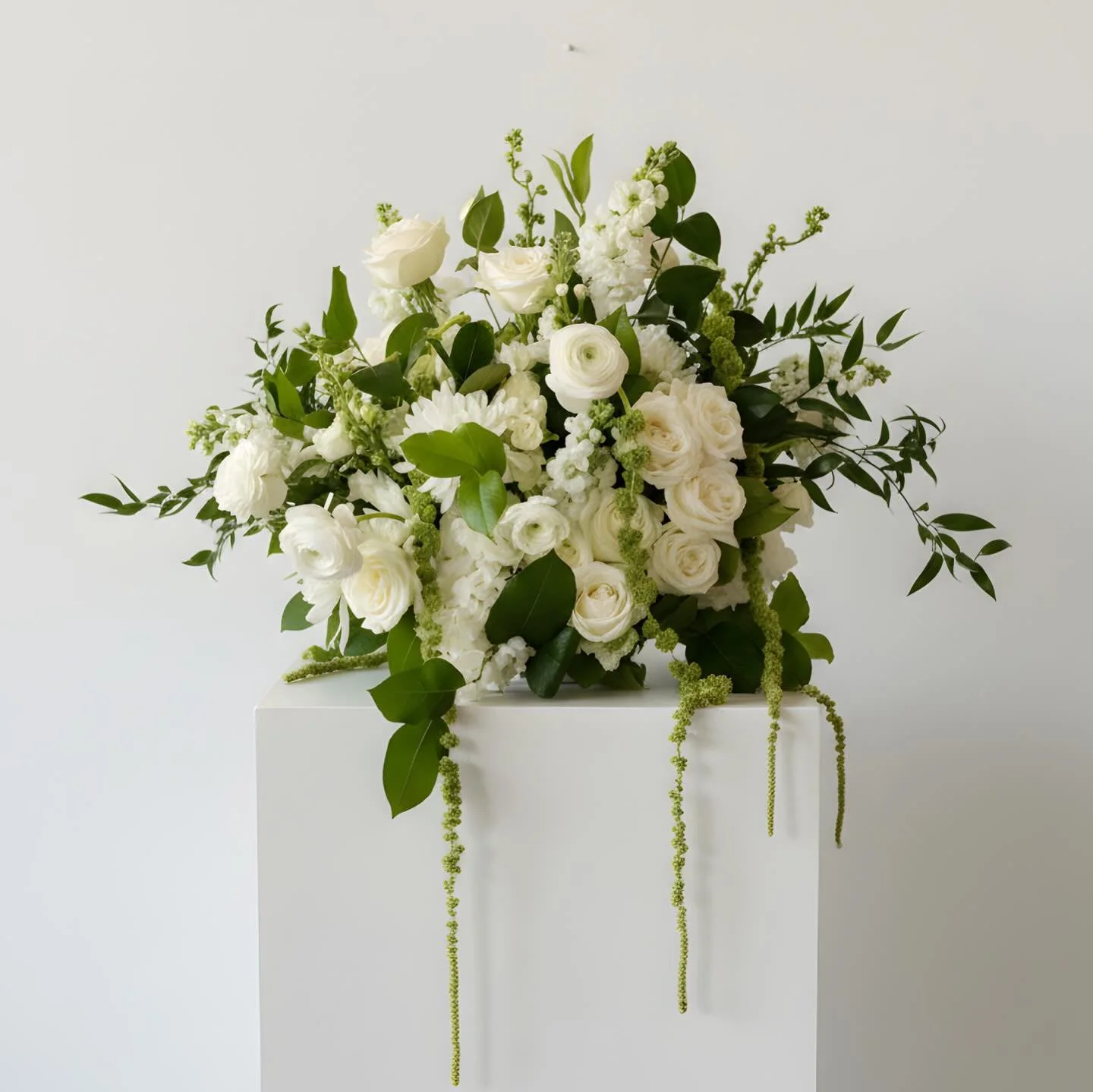 Classic floral design reimagined with a modern twist. We worked closely with our client to ensure each flower element was just right - adjusting scale, adding in hanging amaranthus and various greens, all while keeping the palette and overall look ti