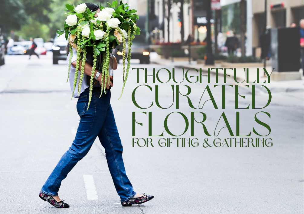 Woman carrying a large flower arrangement in the city of Chicago