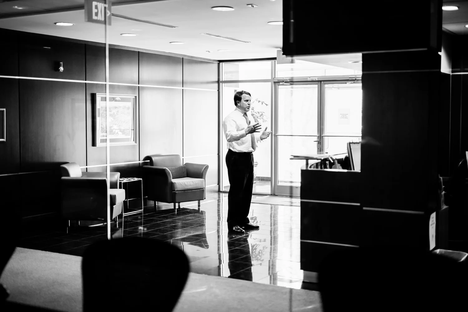 Matthew I. Van Horn speaking inside an office