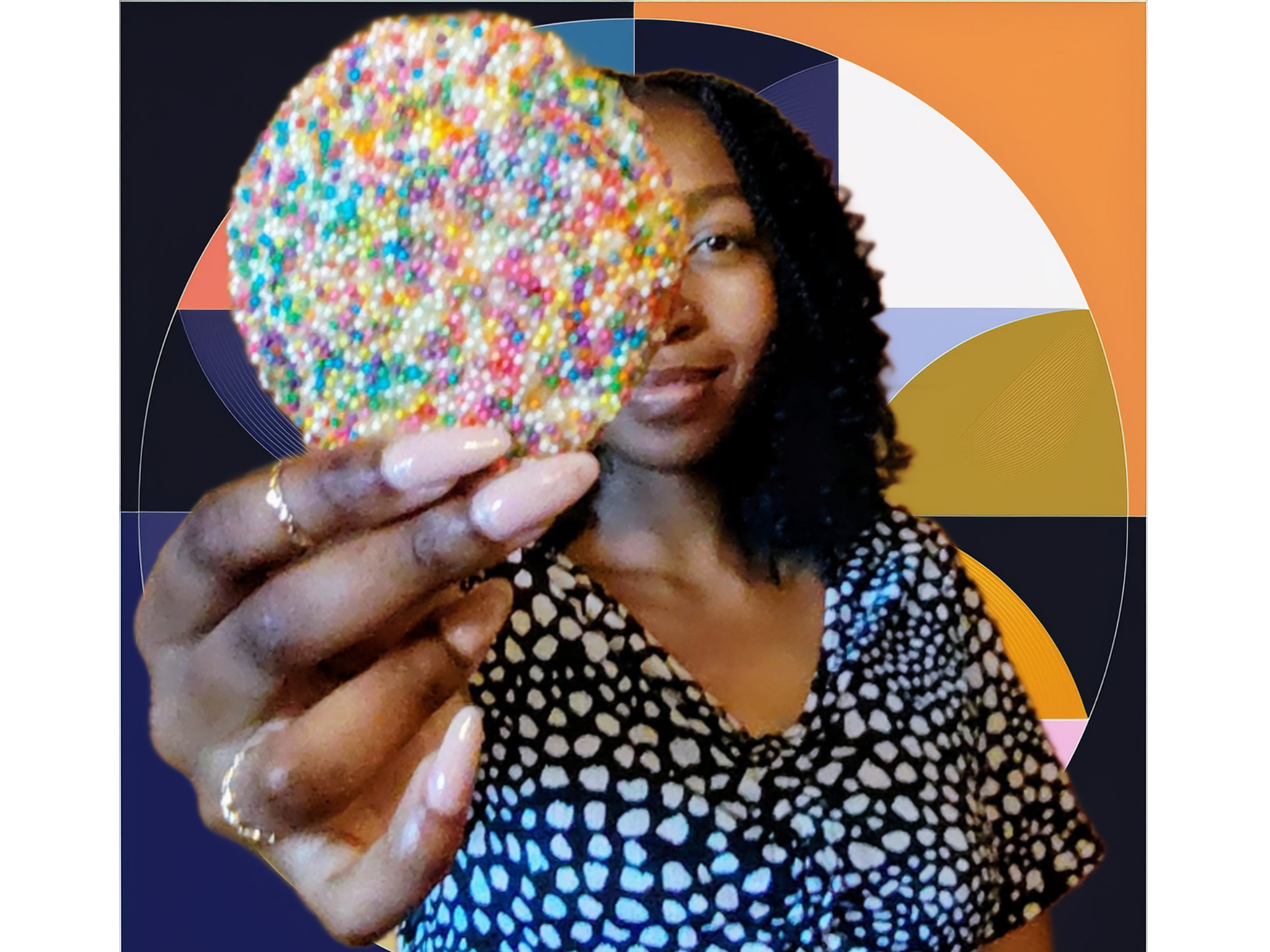 Model, arm outstretched in front of her, holding a delicious, fresh sugar cookie
