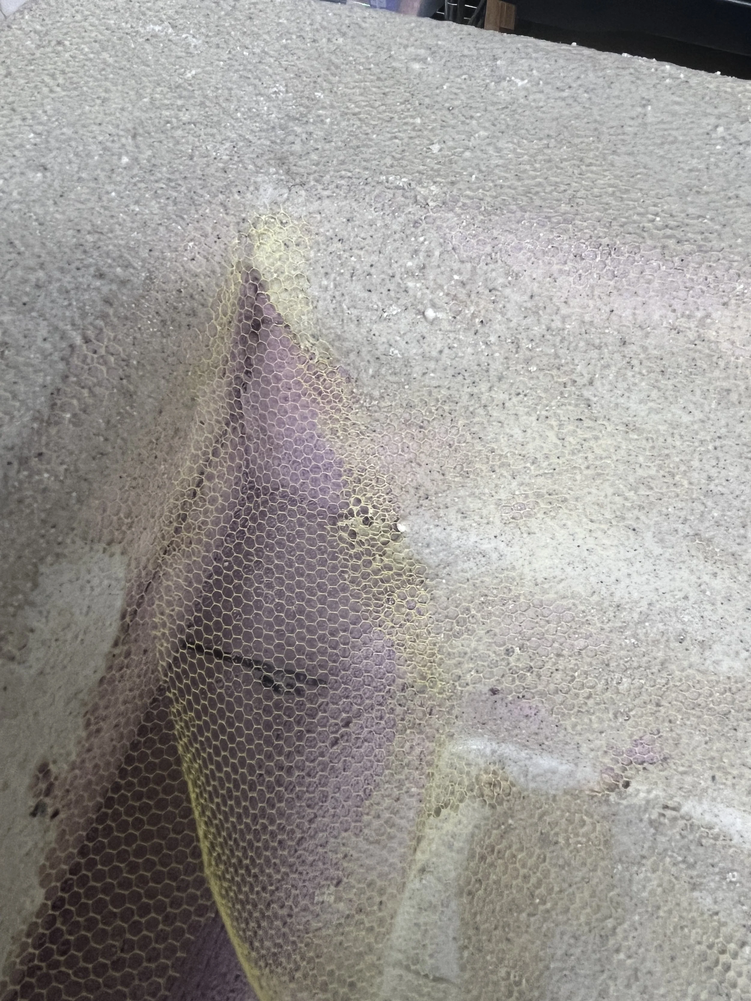 Plaster Mix over Mesh to help stabilize the mixture over the nonporous foam, and help it not crack upon hardening