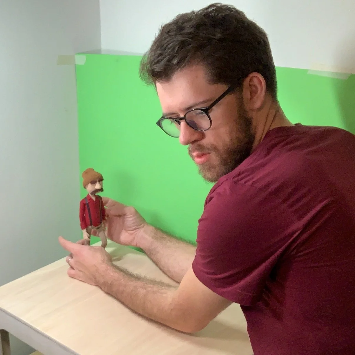 Photo of Connor Yarish with a stop-motion model