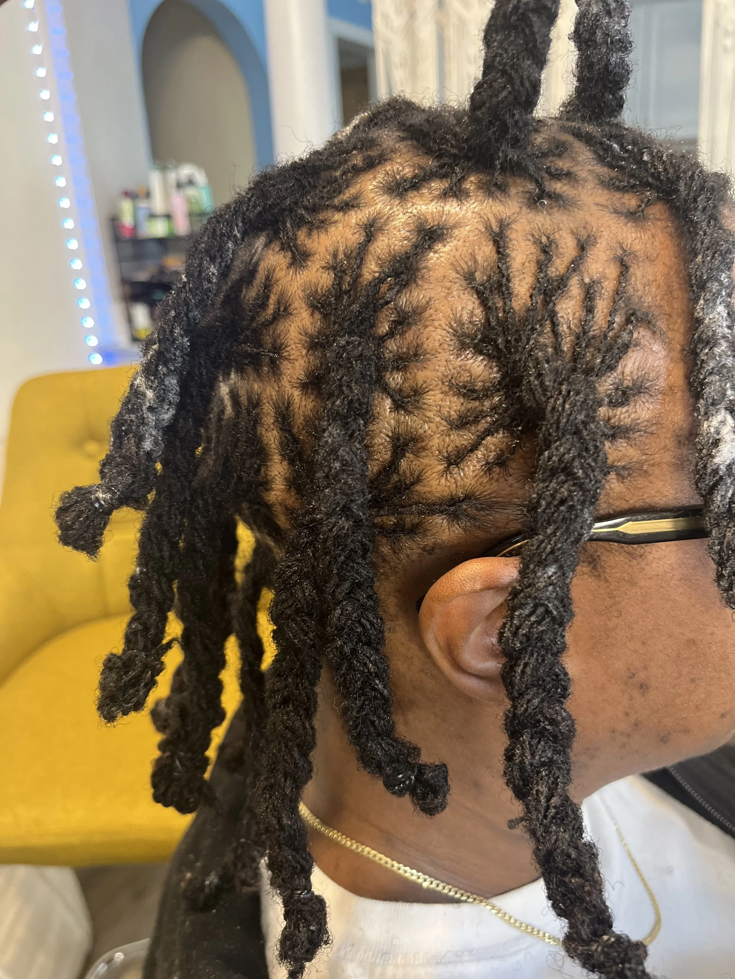 Person with sisterlocks and braid-out.