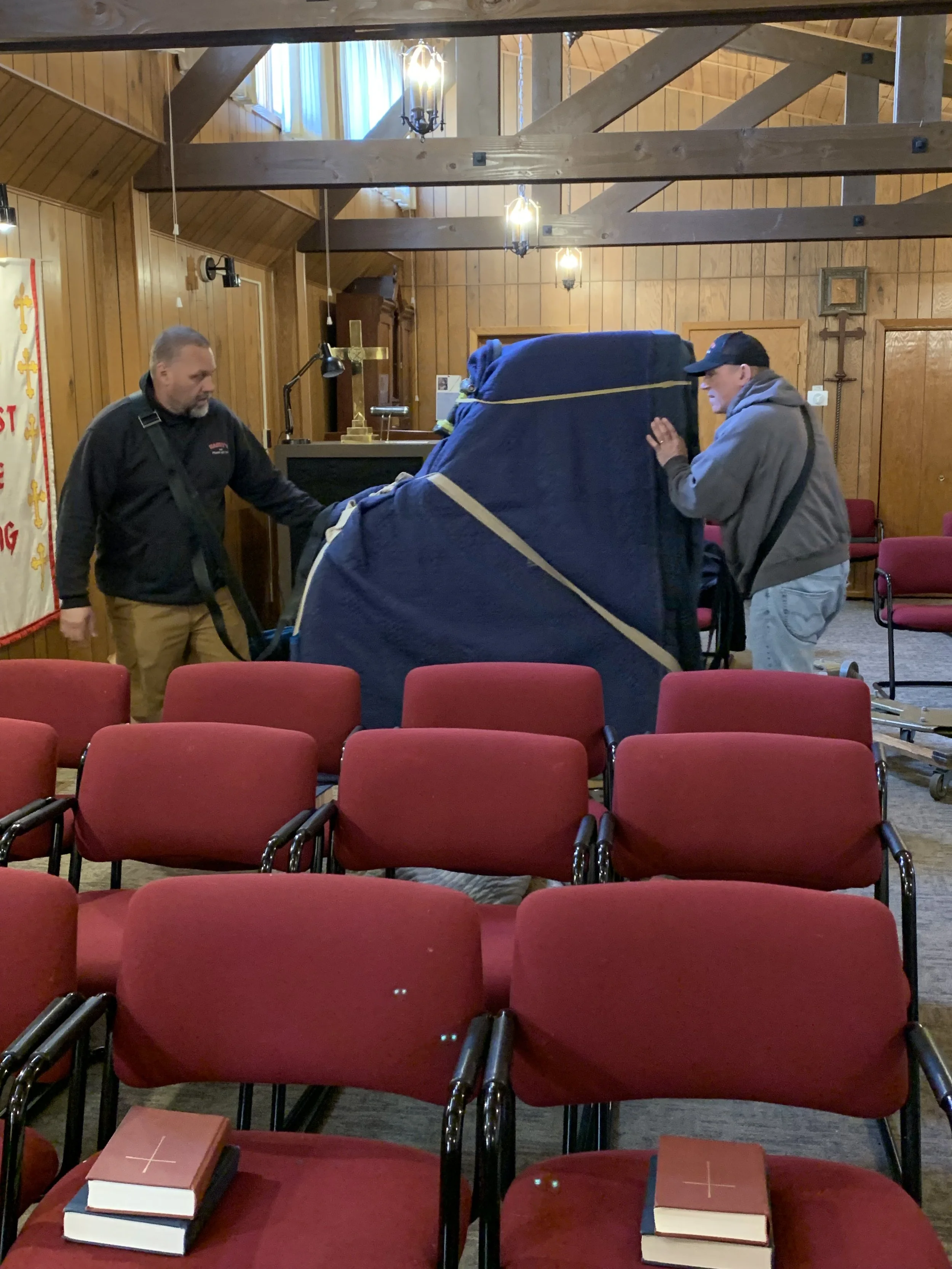 Moving the baby grand into the church, 2026