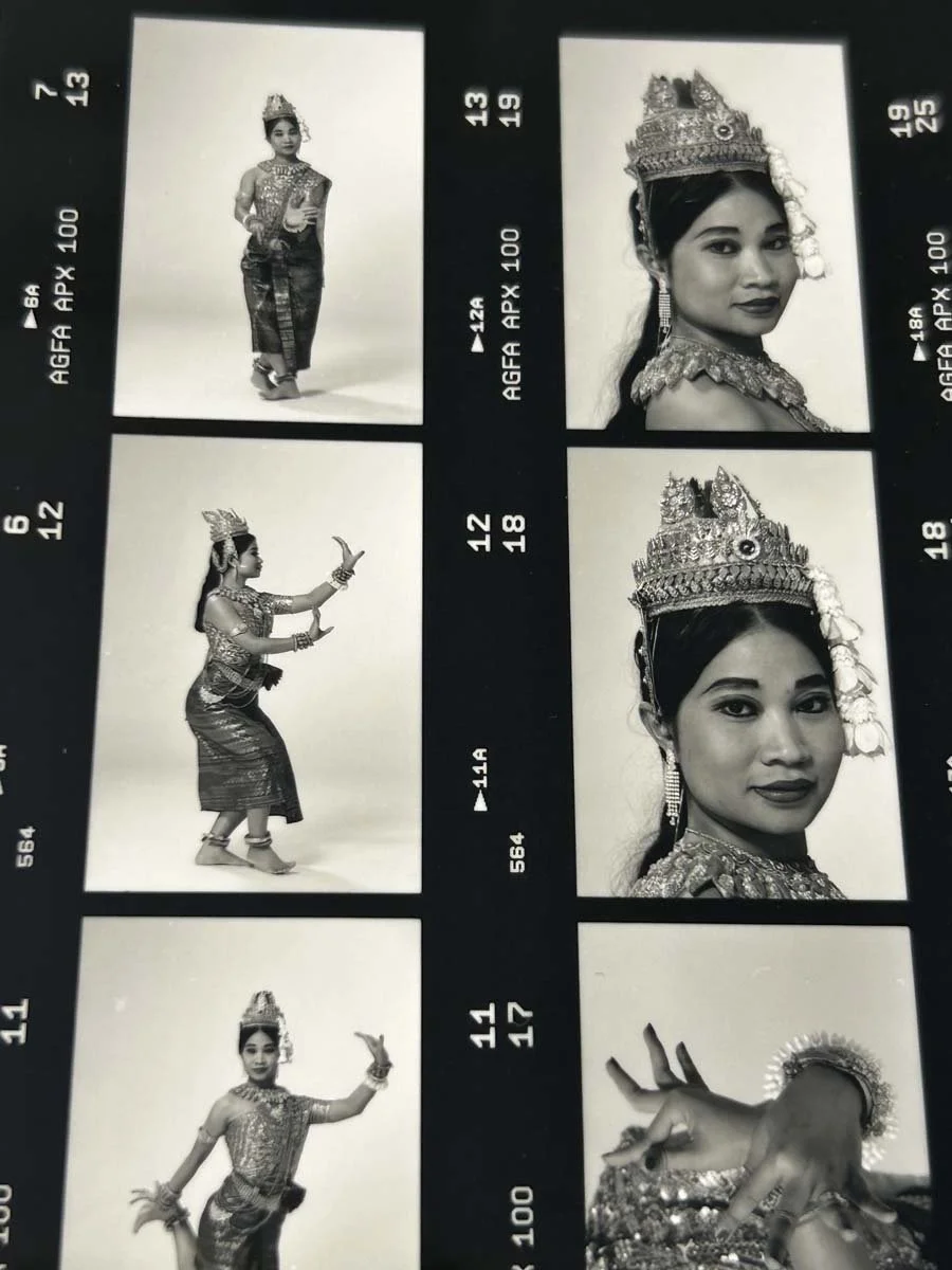 Black-and-white contact sheet showing a Southeast Asian classical dancer in ornate traditional costume and headdress, posing full-length and in close-up portraits.