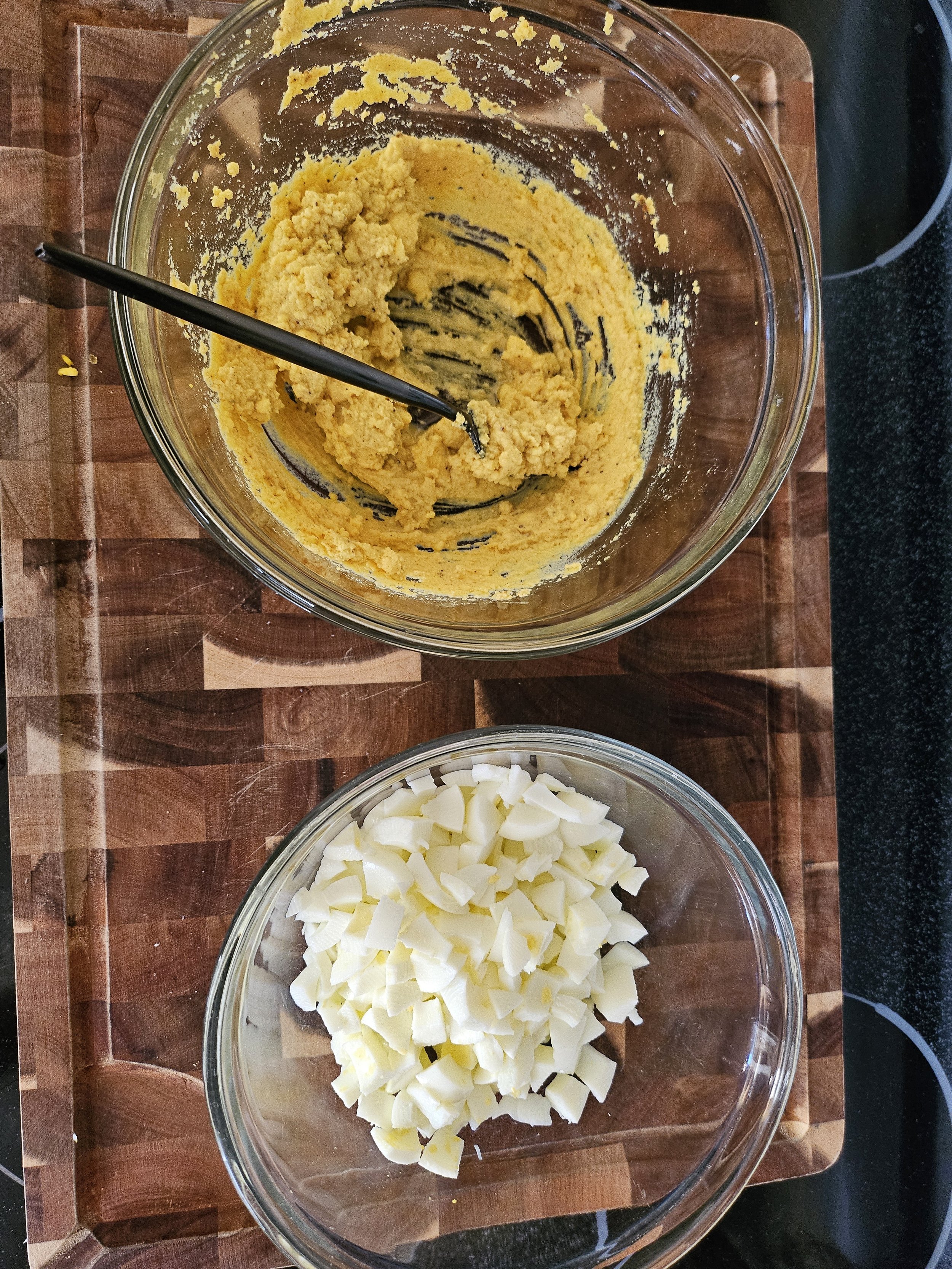 Add mustard, grease, and seasonings to the yolks.