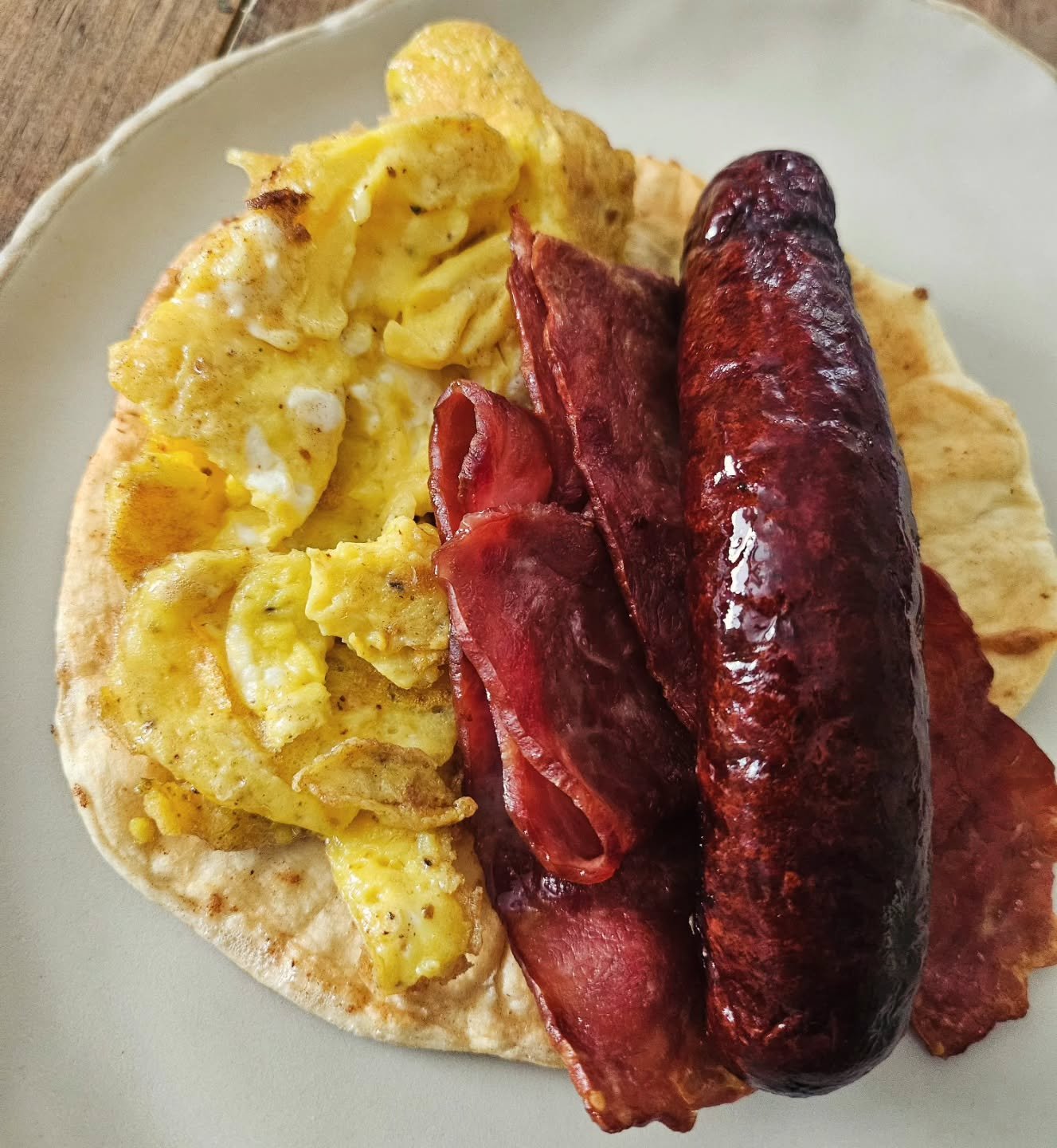 Snow is still falling, and I'm grateful for this warm &amp; satisfying breakfast burrito. It's my first (and probably last) time trying turkey bacon. 🦃 Not horrible, but certainly nothing to write home about. 

Everything else was rockin': six scram