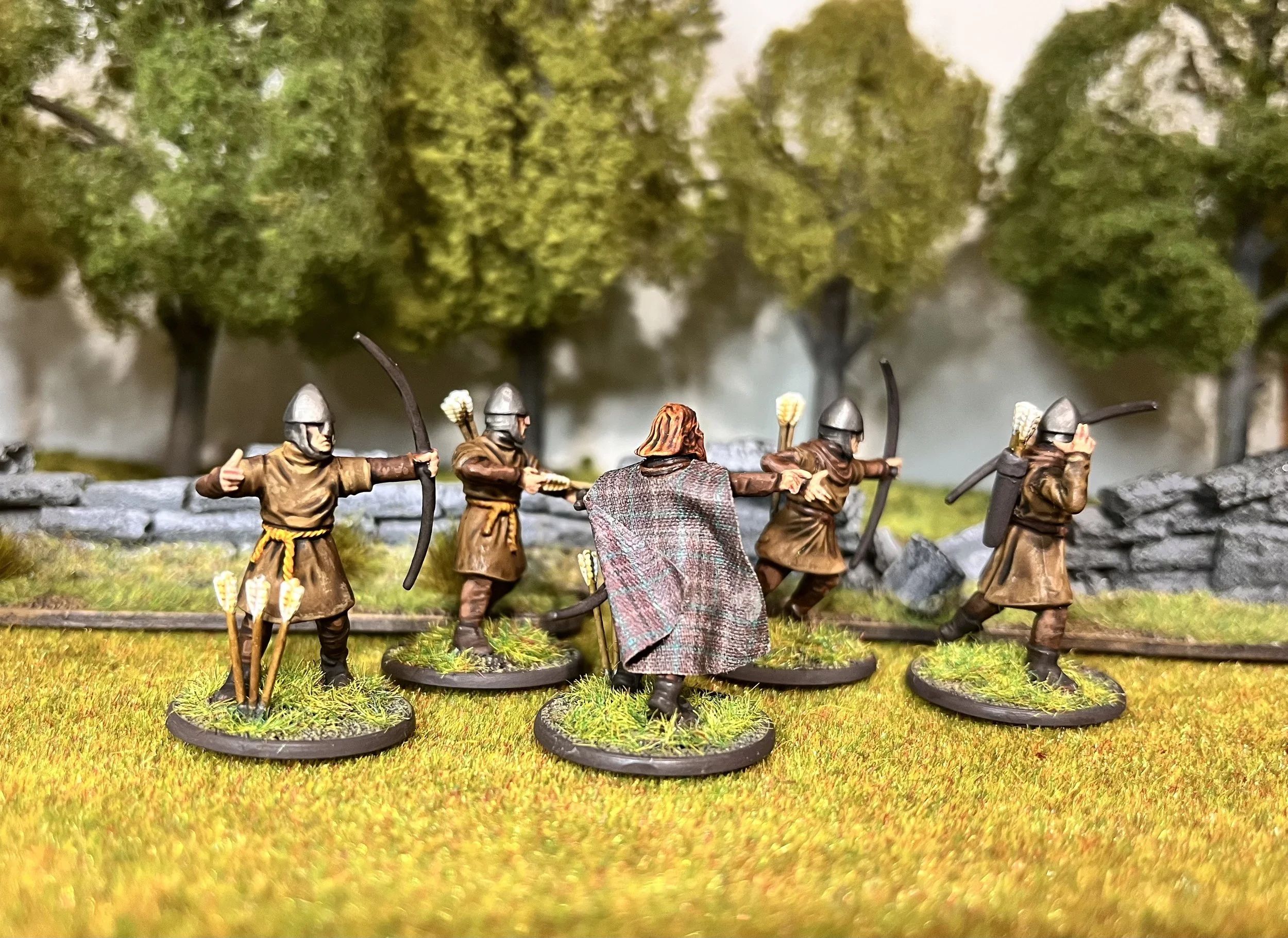 Archers take their positions, bows drawn and eyes sharp. Every arrow could turn the tide.