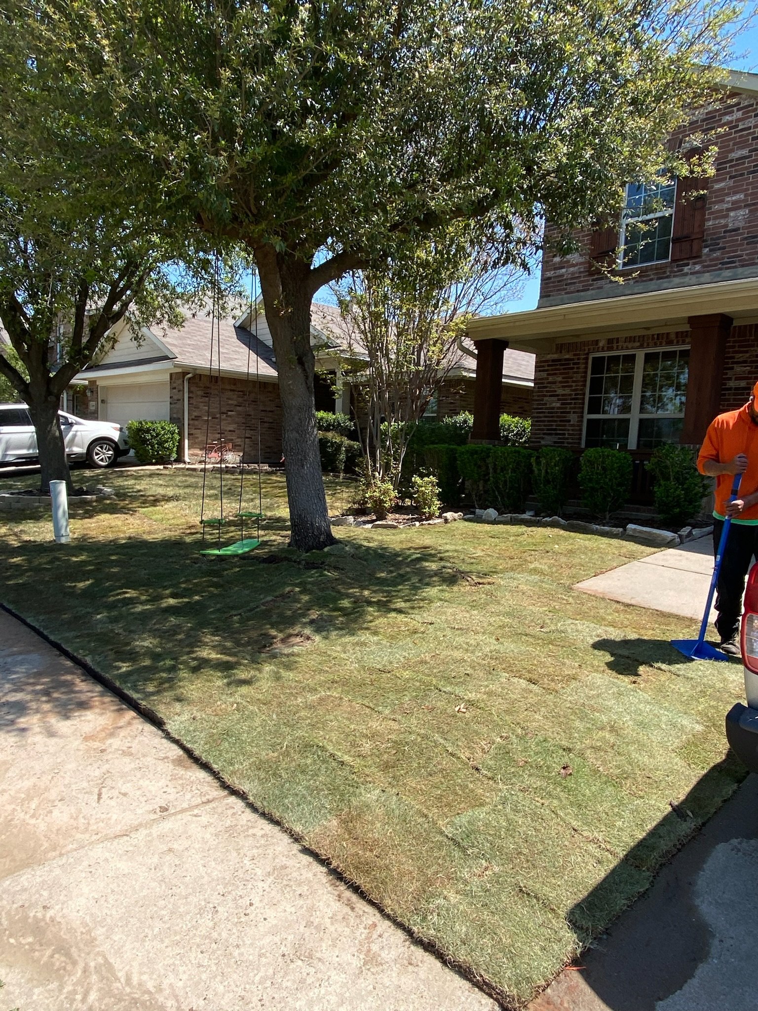 After: fresh Zoysia sod installed with leveled slope and steel border in Rockwall TX