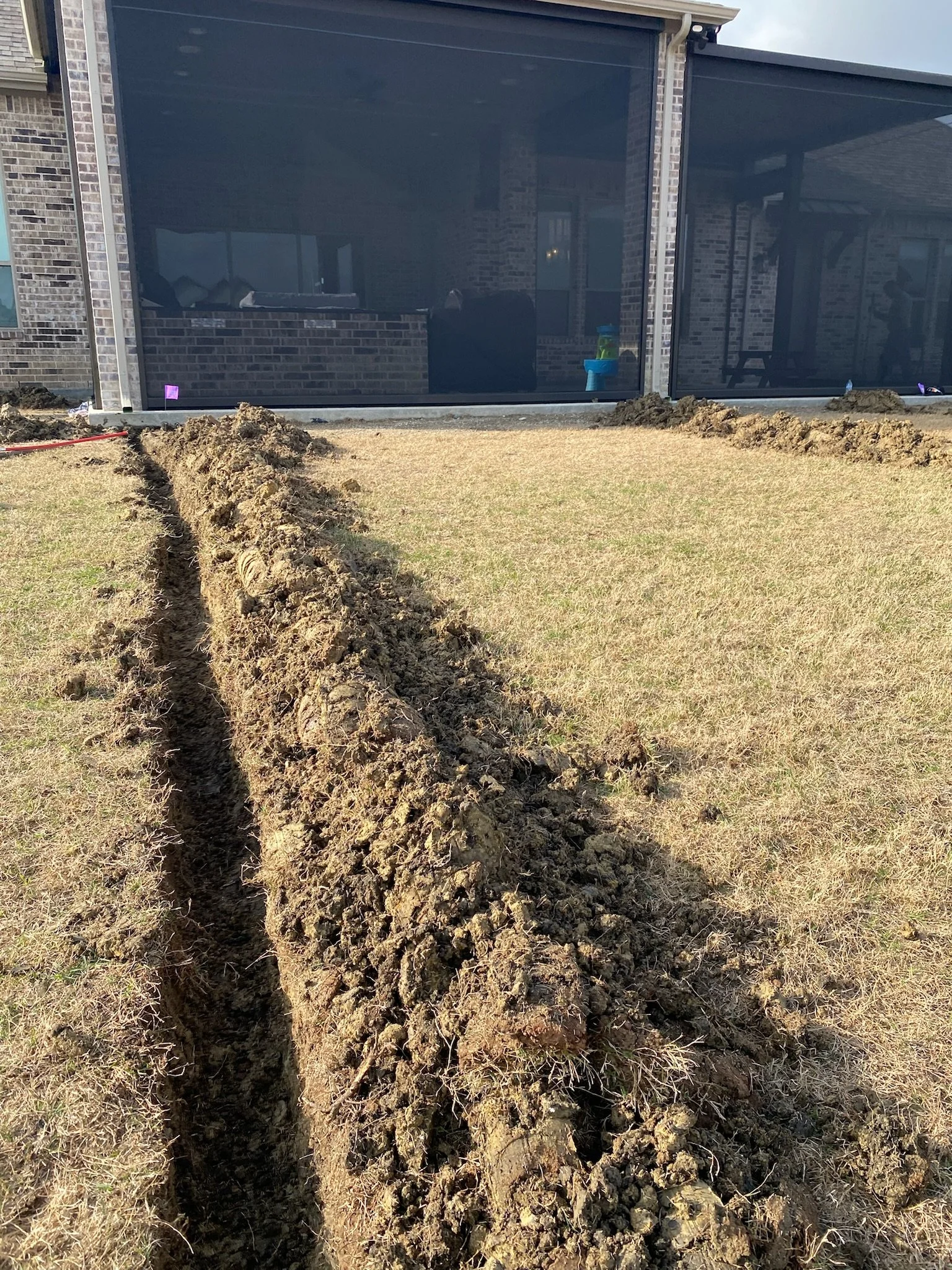 Before: backyard area in Sunnyvale TX prior to French drain installation