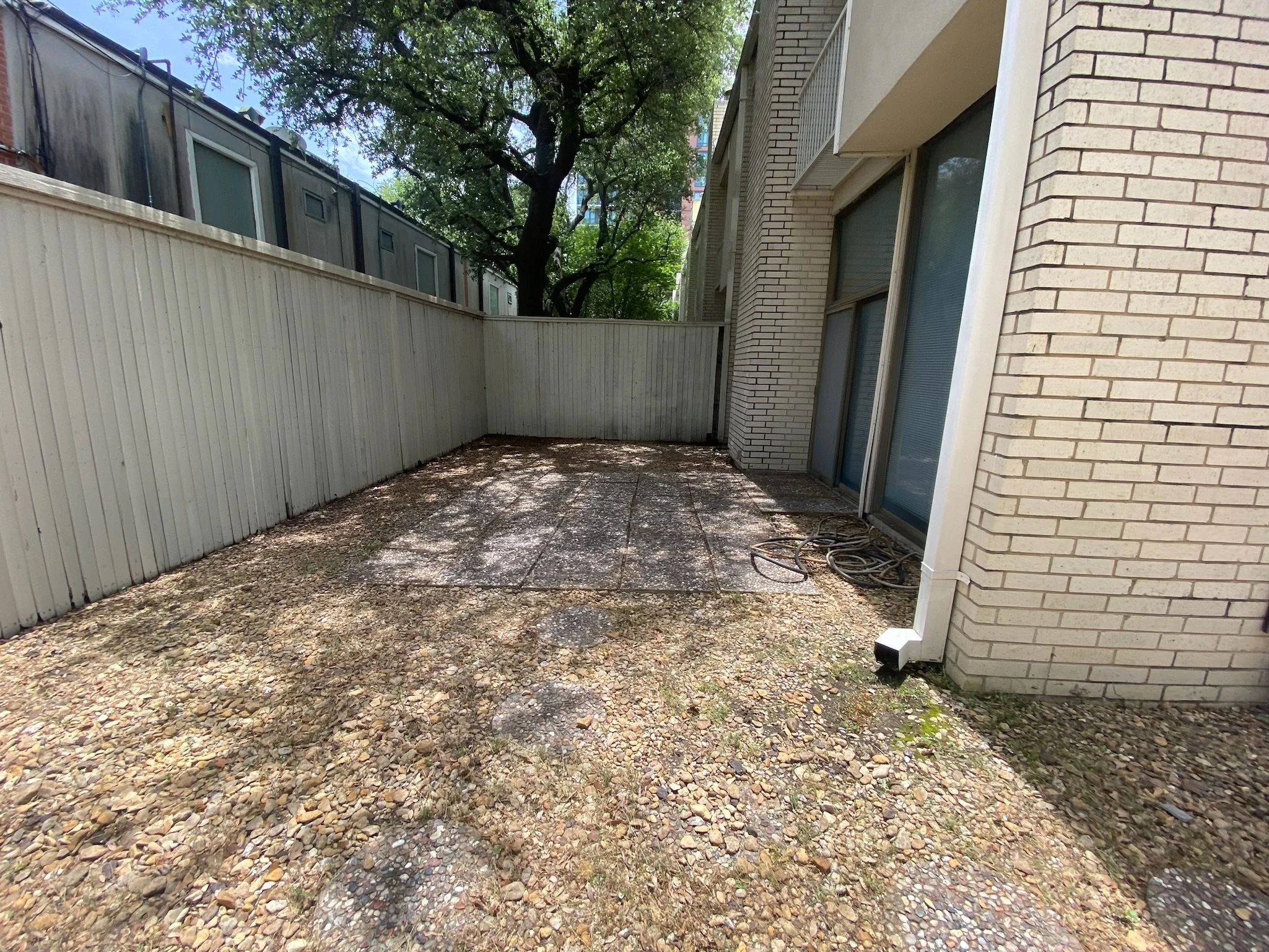After photo of a gravel patio in Dallas, TX following professional weed control treatment.