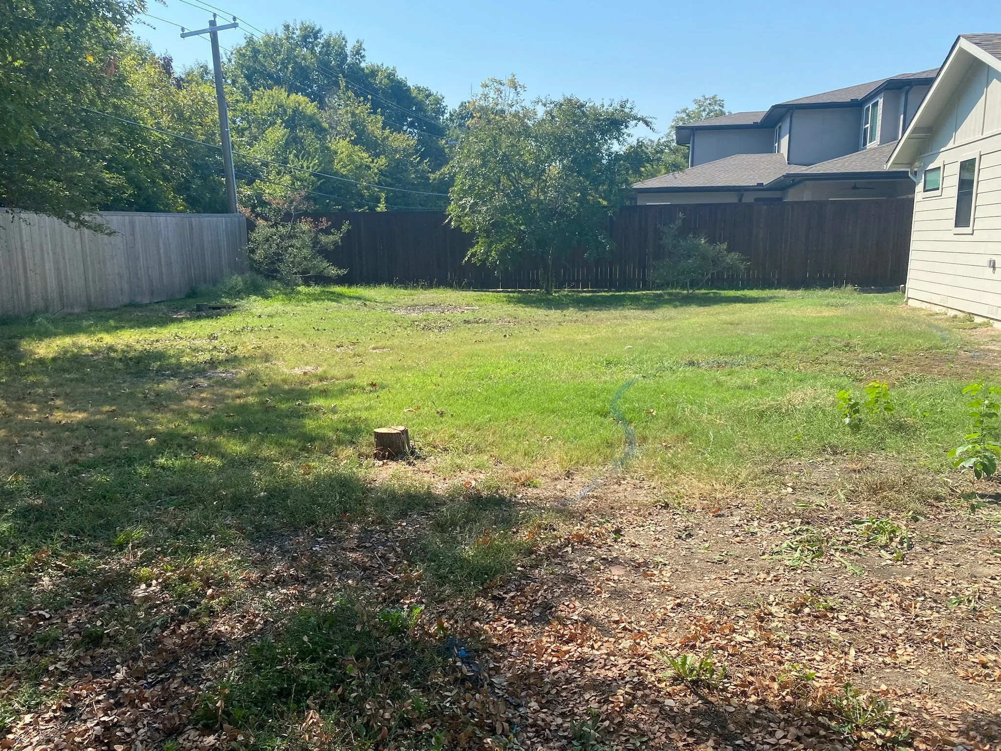 Before: uneven yard before Bermuda sod installation