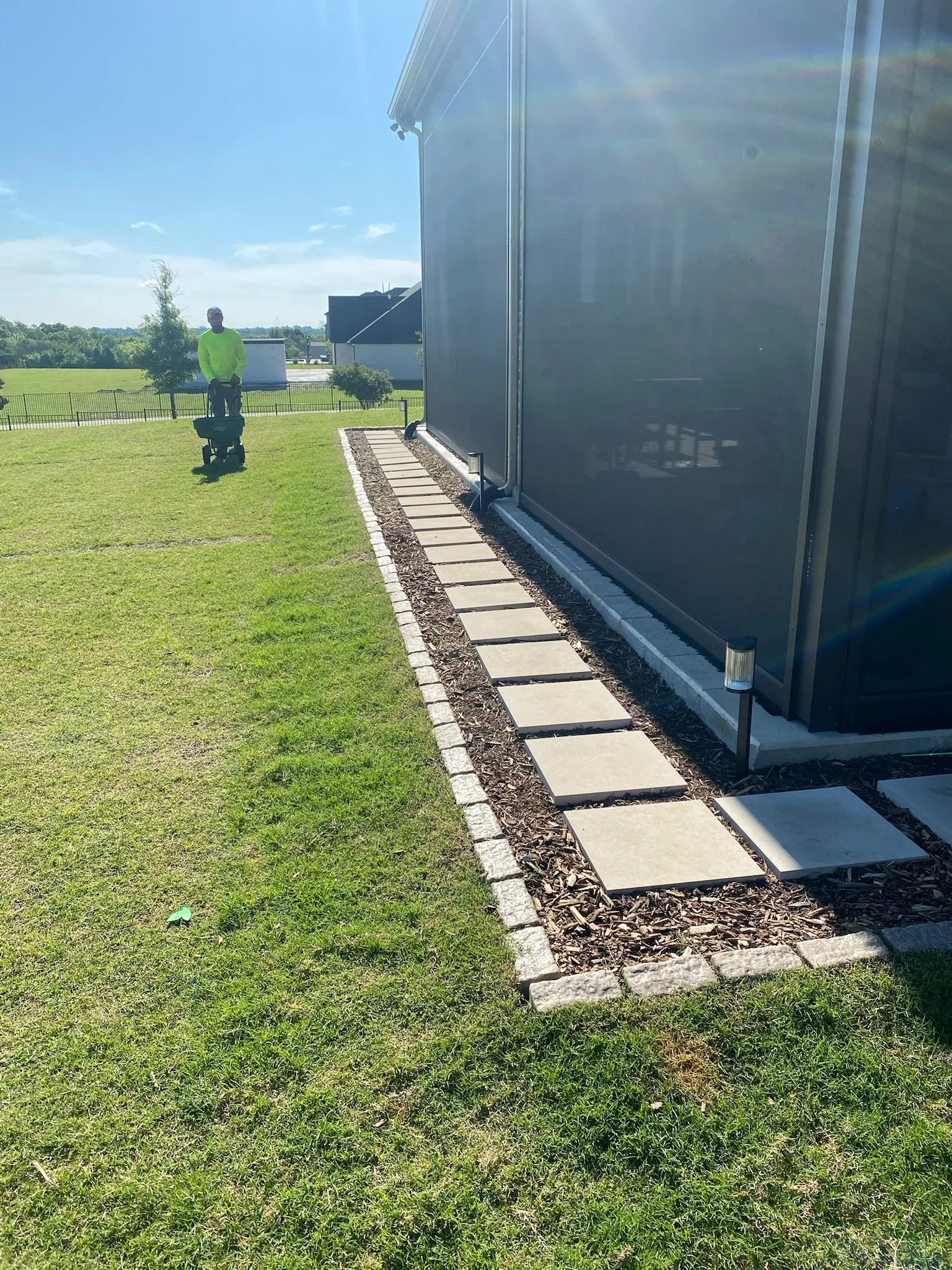 After: custom paver walkway installed with French drain for Sunnyvale TX backyard