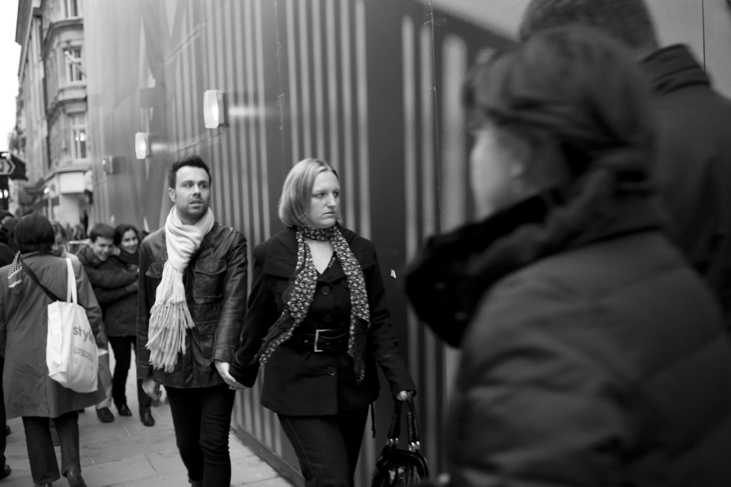 People walking on a city street, black and white photo