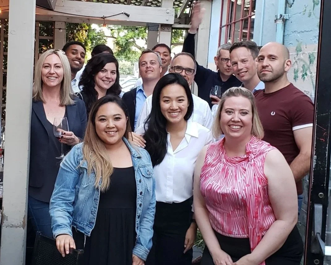 Candice Heidebrecht — Learning & Development Executive | Organizational Effectiveness |  with group of new hire trainees.