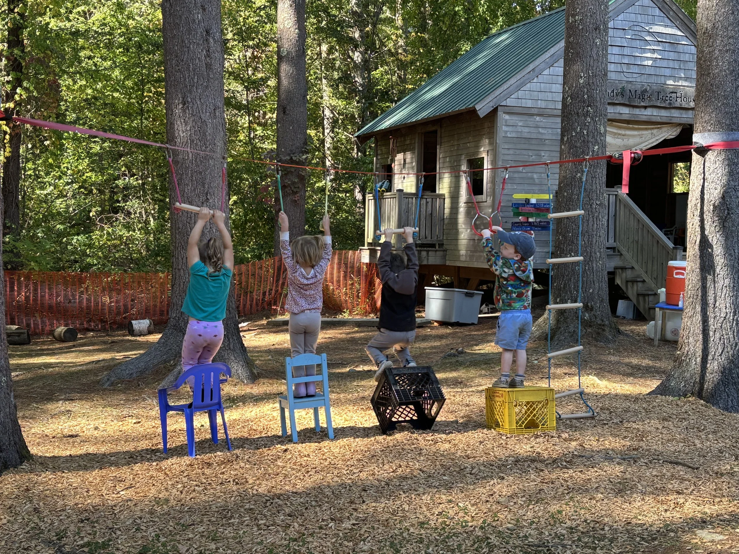 Photo of kiddos playing at an outdoor preschool.