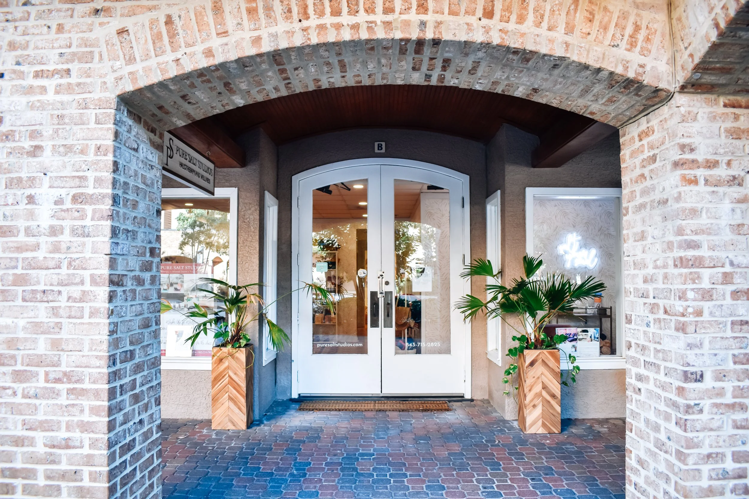 Clean, professional medical spa treatment room with neutral tones at Pure Salt Studios Health and Wellness Spa in Hilton Head