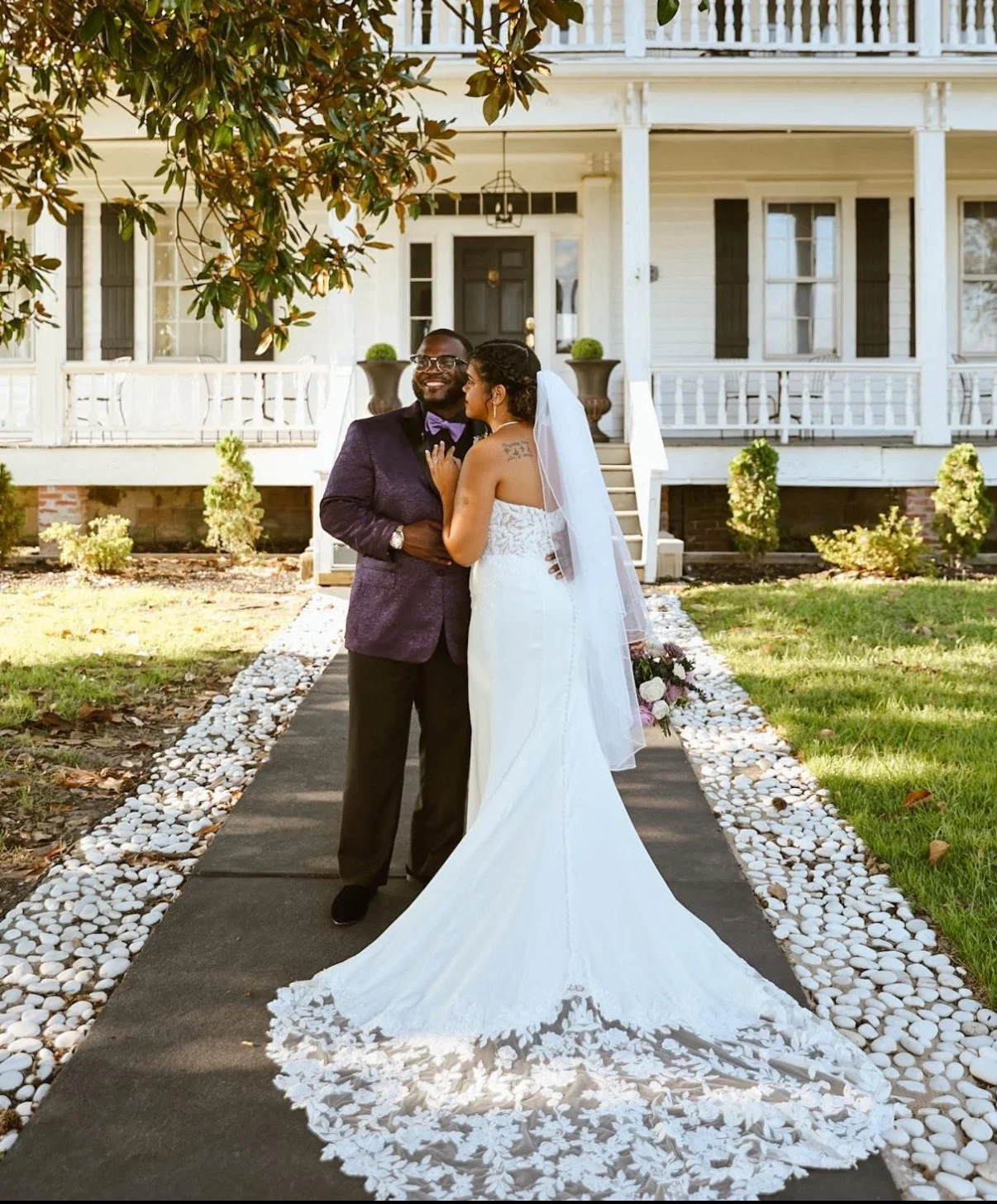 Ashton’s customers, Malik and Melissa posing out in front of a beautiful home