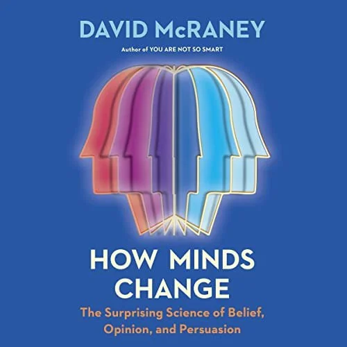 Book cover of 'How Minds Change' by David McRaney featuring overlapping colorful profile silhouettes of human heads on a blue background.