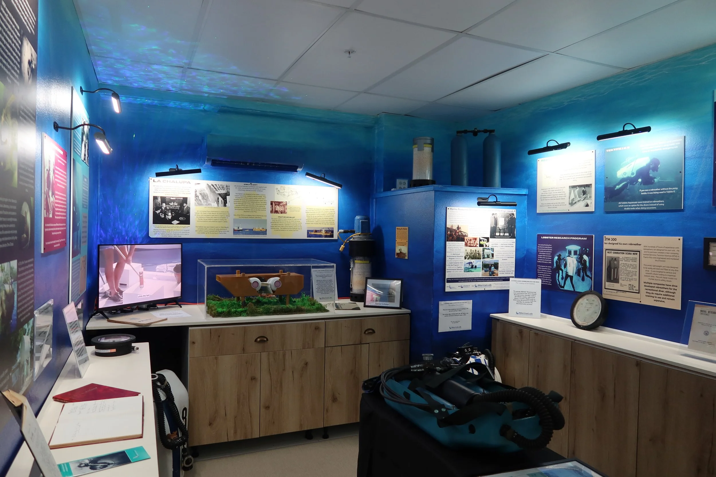 A long view of the Legacy of Ian Koblick exhibit showing the multiple information boards and artifacts on display