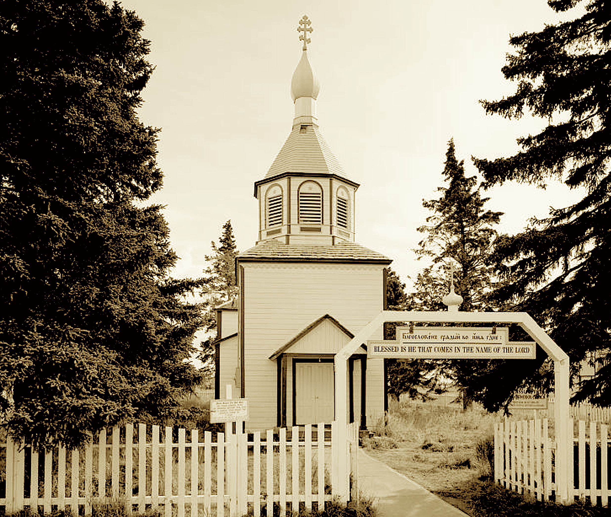Where the Dena’ina once cast out their line,
And Russian-built forts marked a new border sign,
A bell tower rises in classic array
To echo the chants of an Orthodox day.
Oldest of churches still gracing the strand—
A sanctuary carved in a far norther