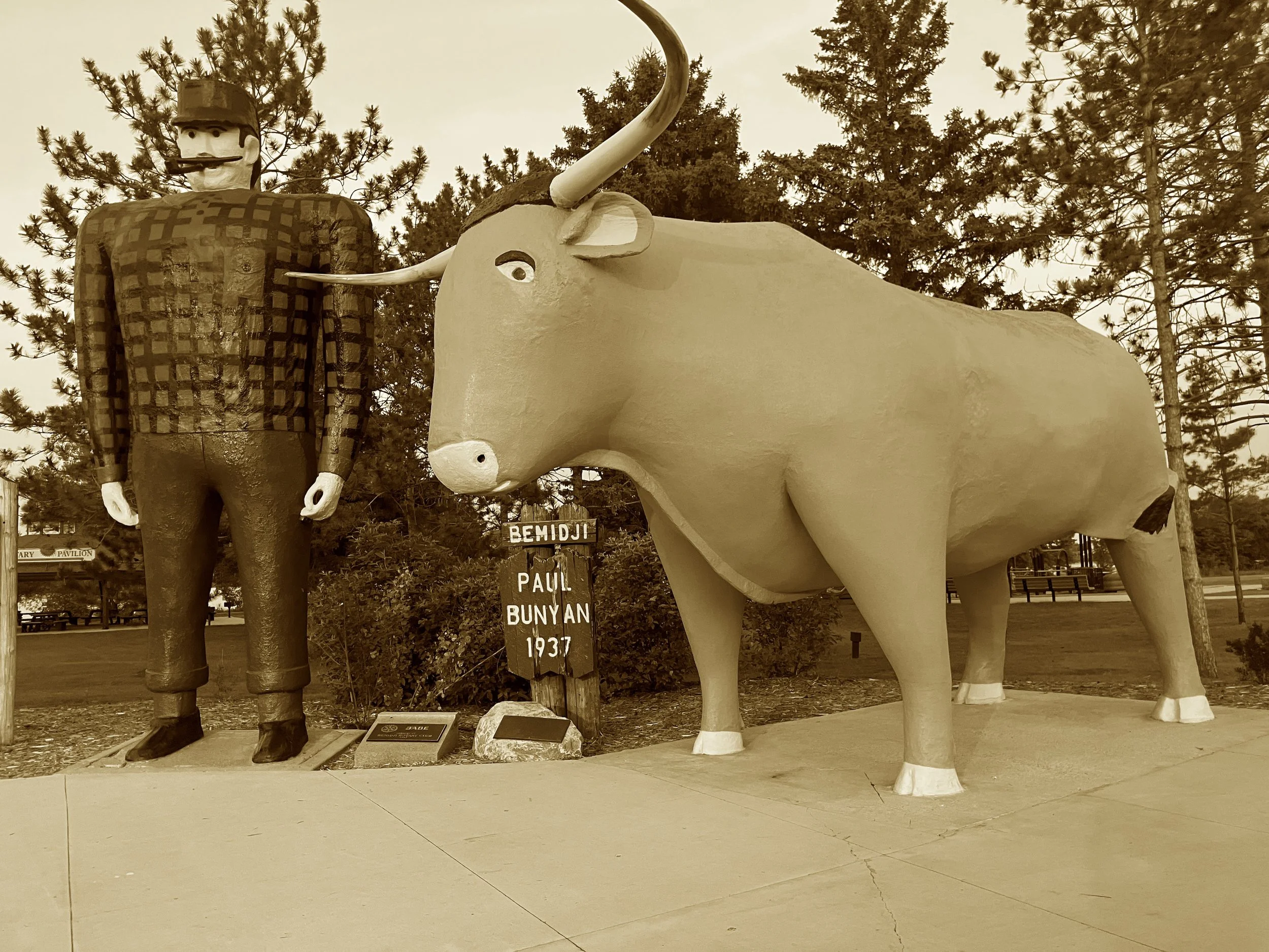 A plaid-shirted giant with ox by his side,
They summoned up smiles on a wintry ride.
Roadside Americana at its most fun—
Two legends in lumber, carved just for the pun.
