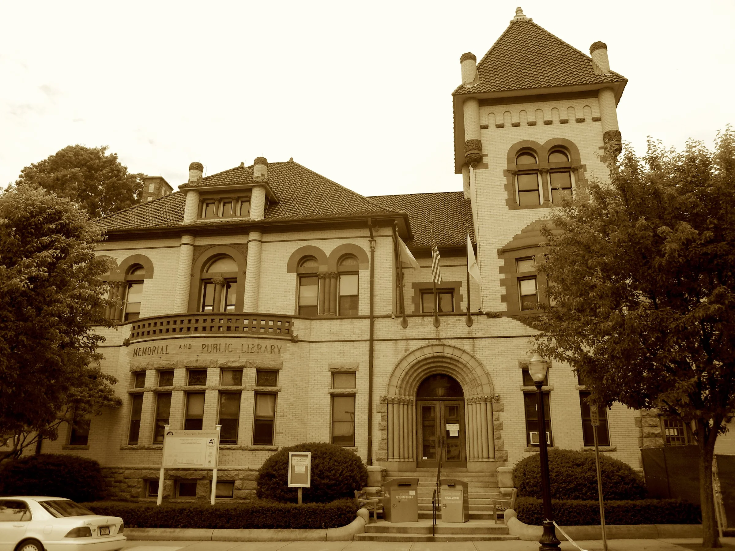 Where boilers once the ships empowered,
A golden hall of books now towered—
By Wilcox's dream and dollars showered.
With bowling, books, and vet parade,
It honors those who duty paid—
And knowledge in their names displayed.
