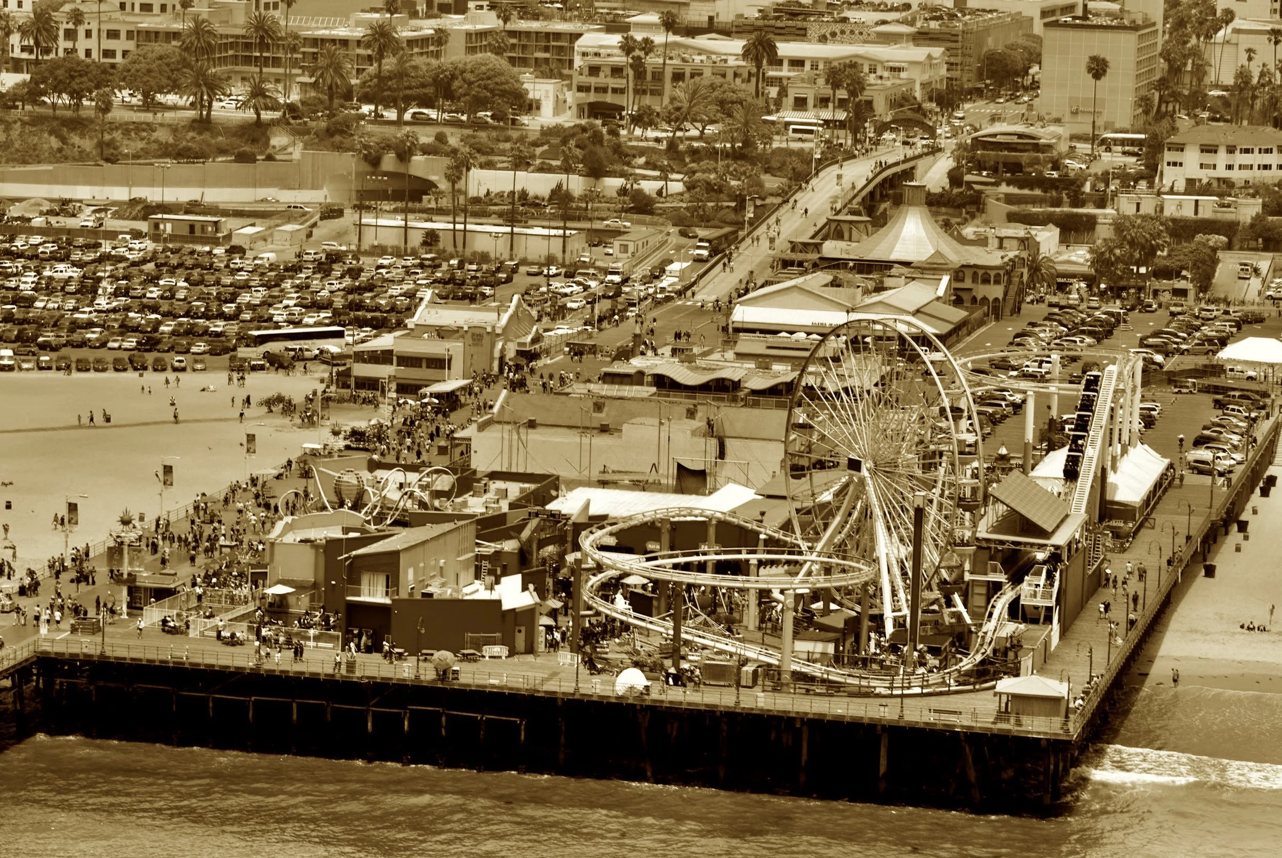 Though Route 66 took its final breath
At Lincoln & Olympic (per the fed's own edict’s depth),
Folks drove a bit more to end their quest
At the pier where sunsets are truly the best.
The sign says “End of the Trail” by the sea—
Not official, but who’d