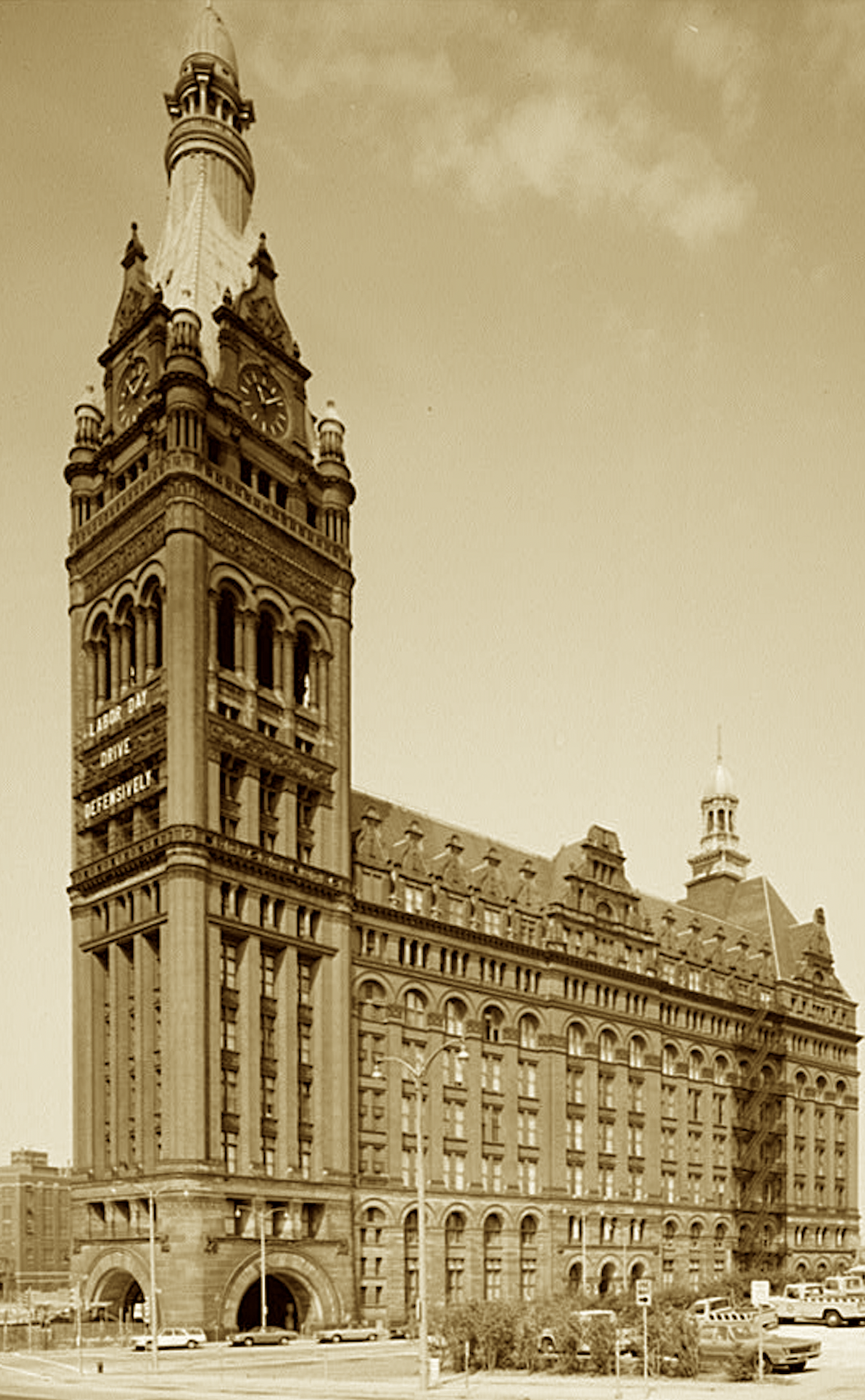 Its tower pierced the Midwestern haze,
The second-tallest of its days.
With Gothic grace and Flemish face,
It crowned a town of grit and pace.
On sunken piers it firmly stood—
Where wheat and beer met iron and wood.