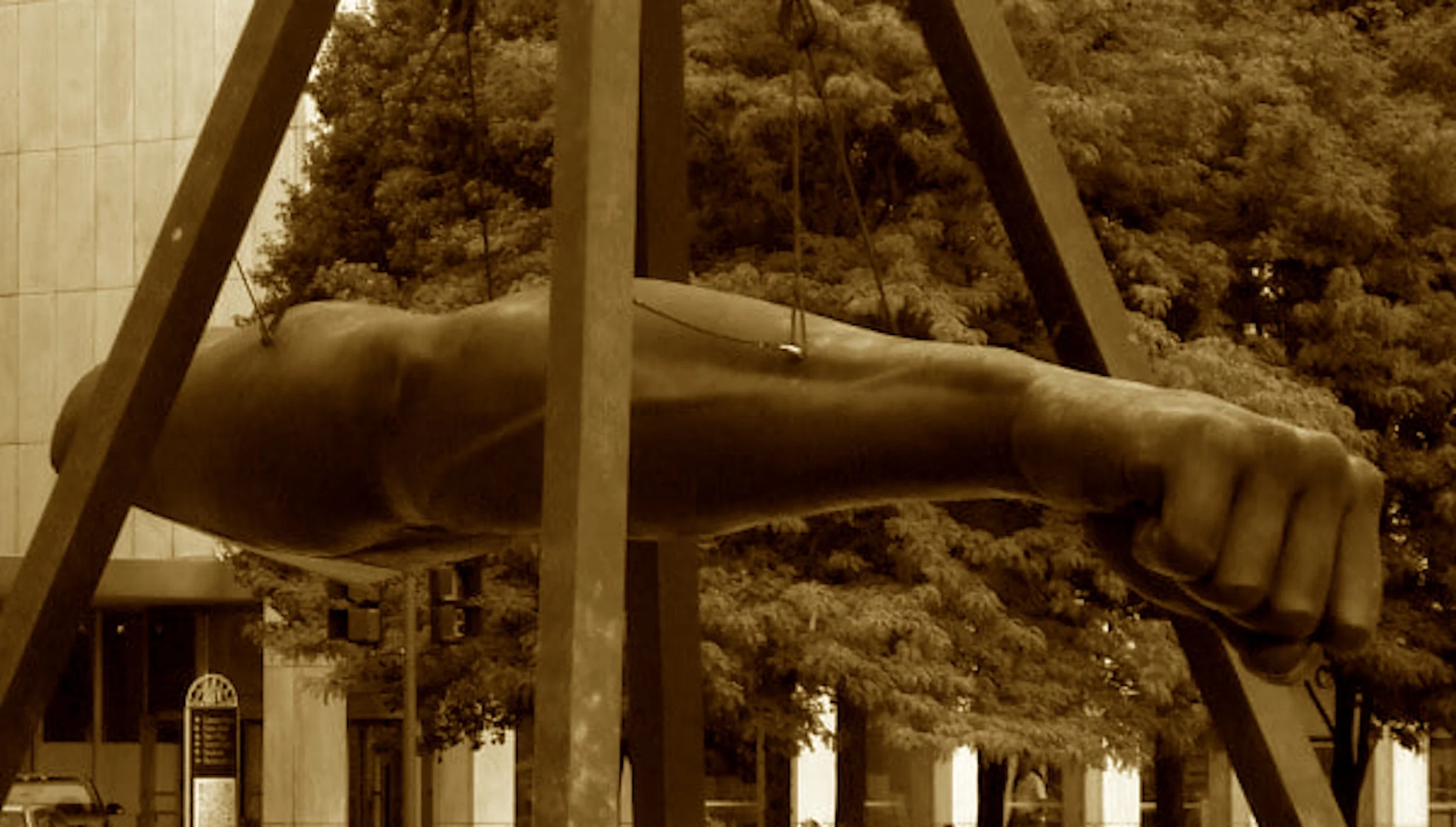 A thunderous arm in bronzed defiance,
A symbol forged in racial science.
Joe Louis’ punch, so fast, so clean,
Laid low a myth and shook the scene.
This city’s son with might uncurled—
A fist that shook the watching world.