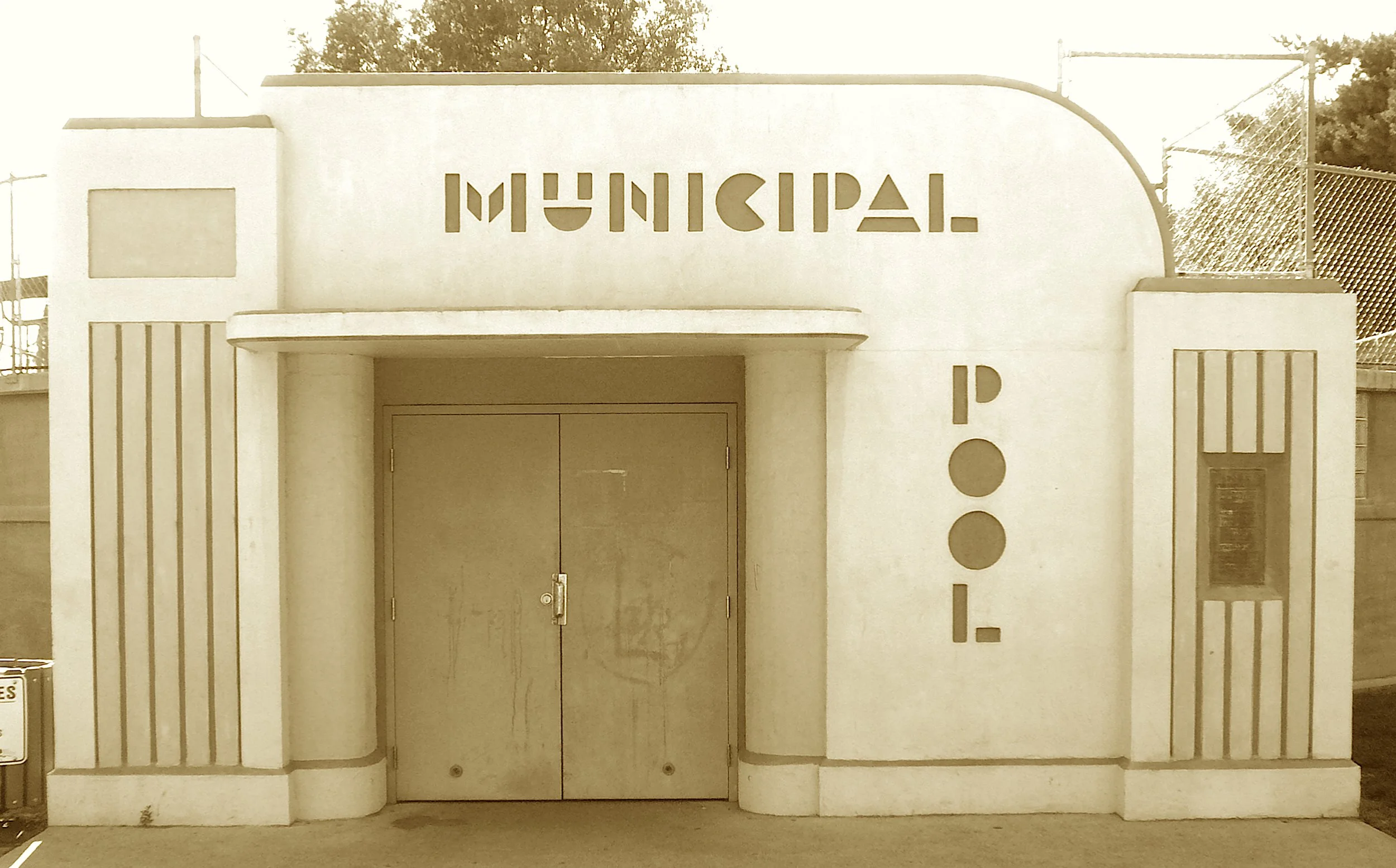 Above the ground, a pool took flight,
In Moderne curves of smooth cement white.
A Bintz-built splash where kids once played,
Before the lanes brought swim meets’ grade.
Its egg-shaped charm still stands with pride,
As Boise’s cool aquatic guide.