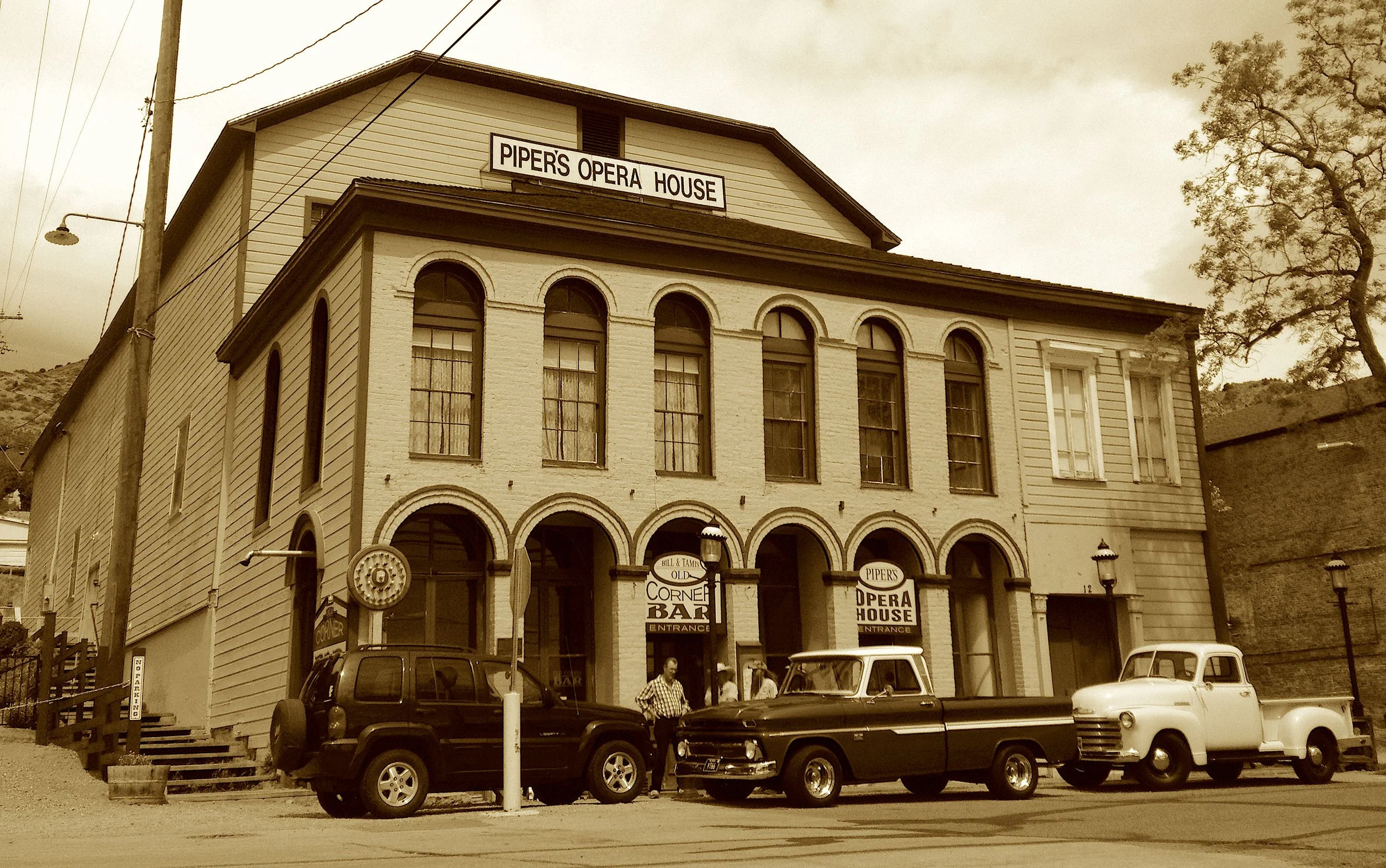 Three houses burned, but art stood tall
In Piper’s stage, above it all.
From plays to fights, from songs to skates,
The town’s grand hall swung fortune’s gates.
Now tales encore where curtains rise—
In one of few that still defies.